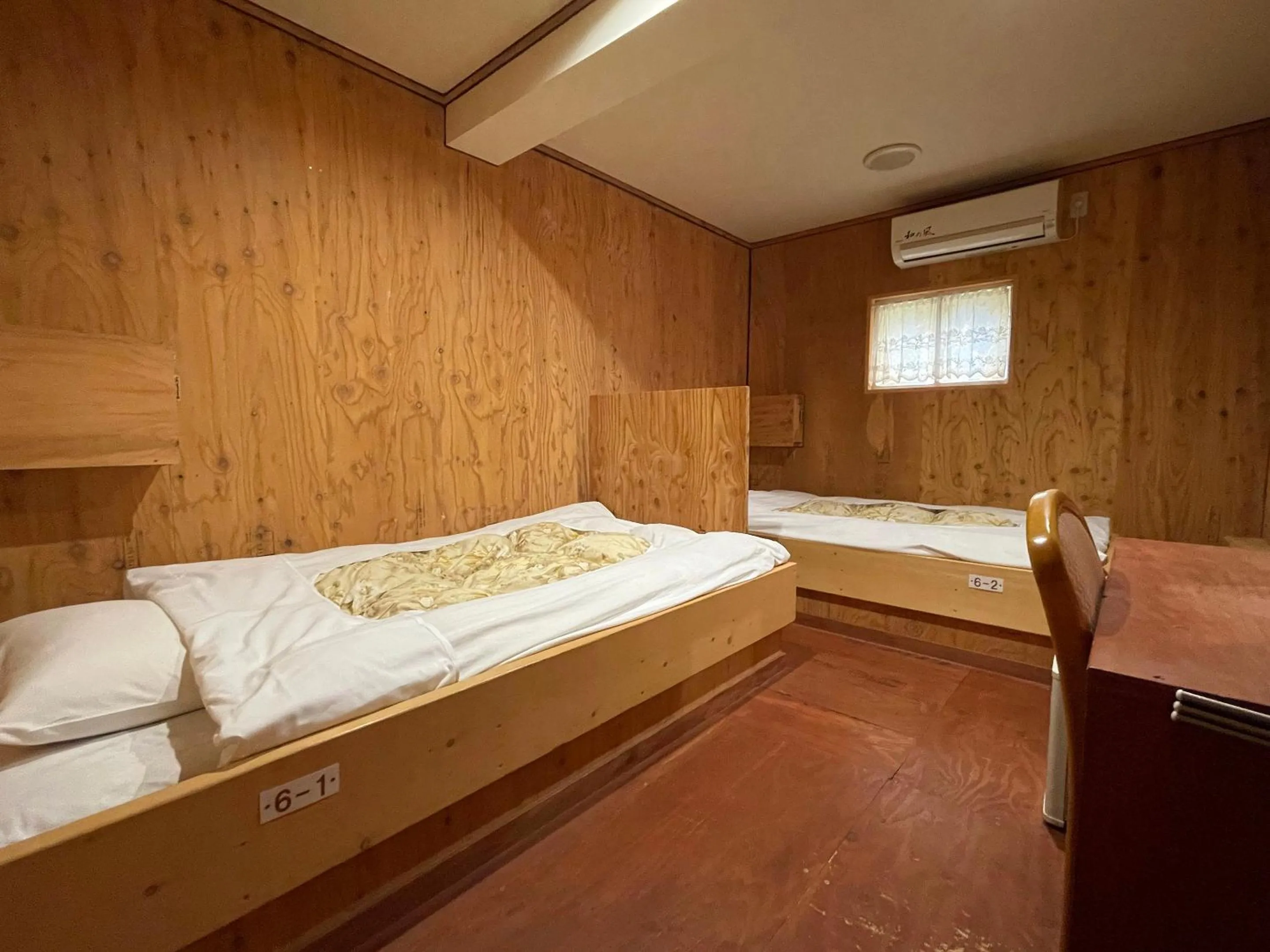 Bedroom, Bed in Guesthouse Otaru Wanokaze