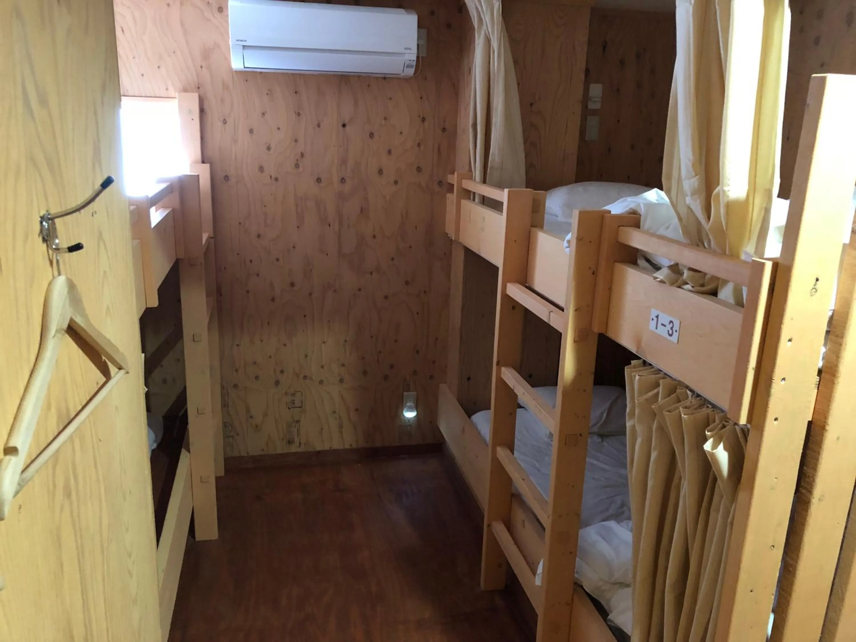 Bed in Guesthouse Otaru Wanokaze