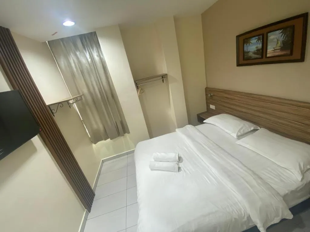 Bed in BG Business Hotel