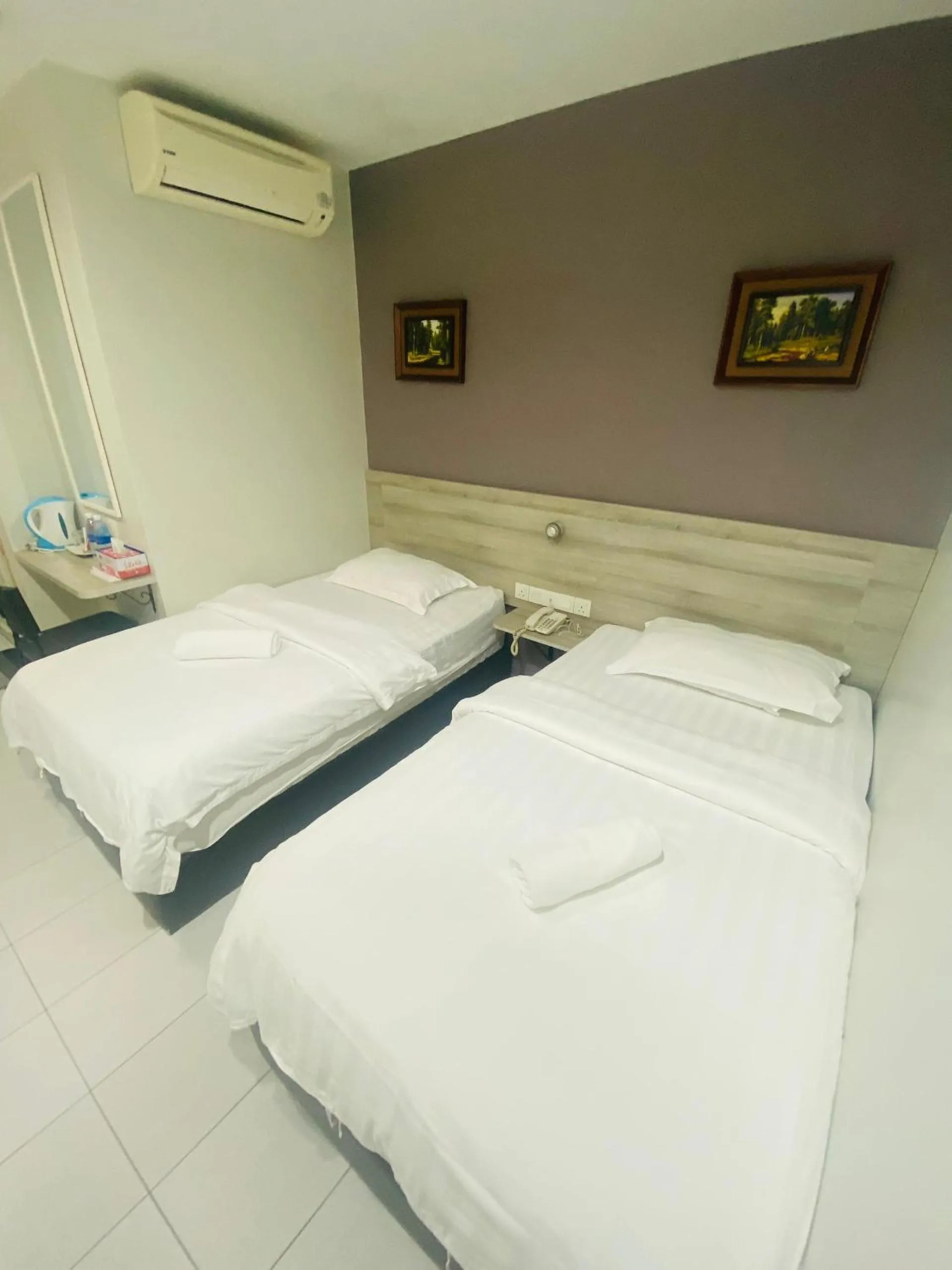 Bed in BG Business Hotel