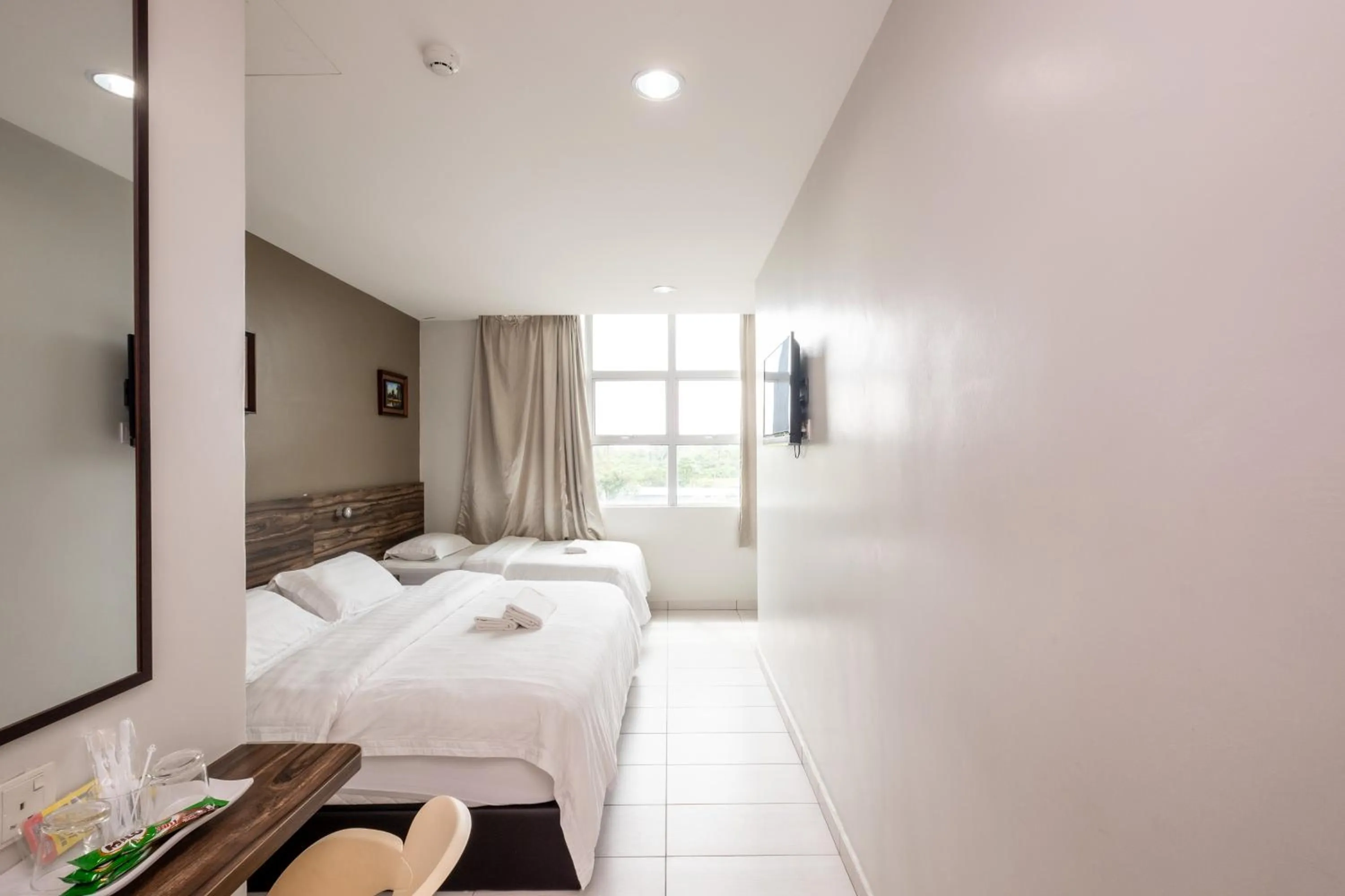 Bed in BG Business Hotel