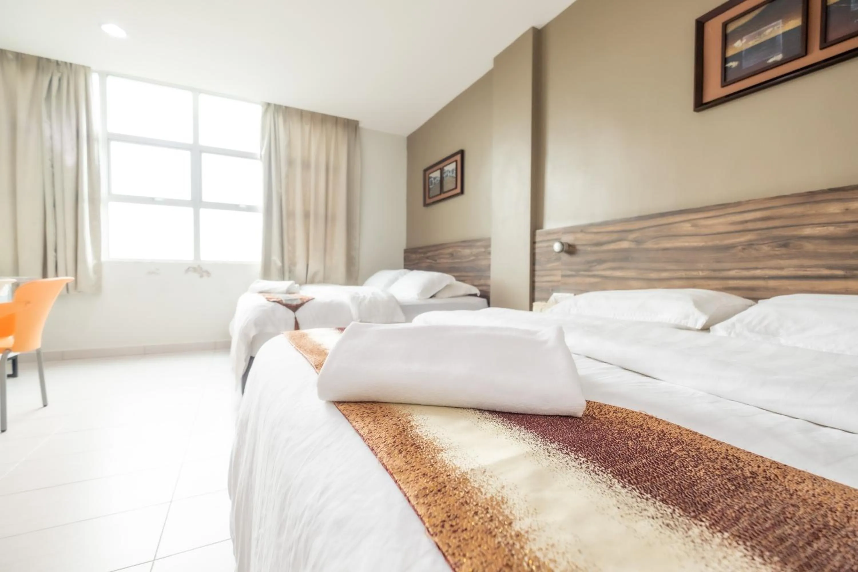 Bed in BG Business Hotel