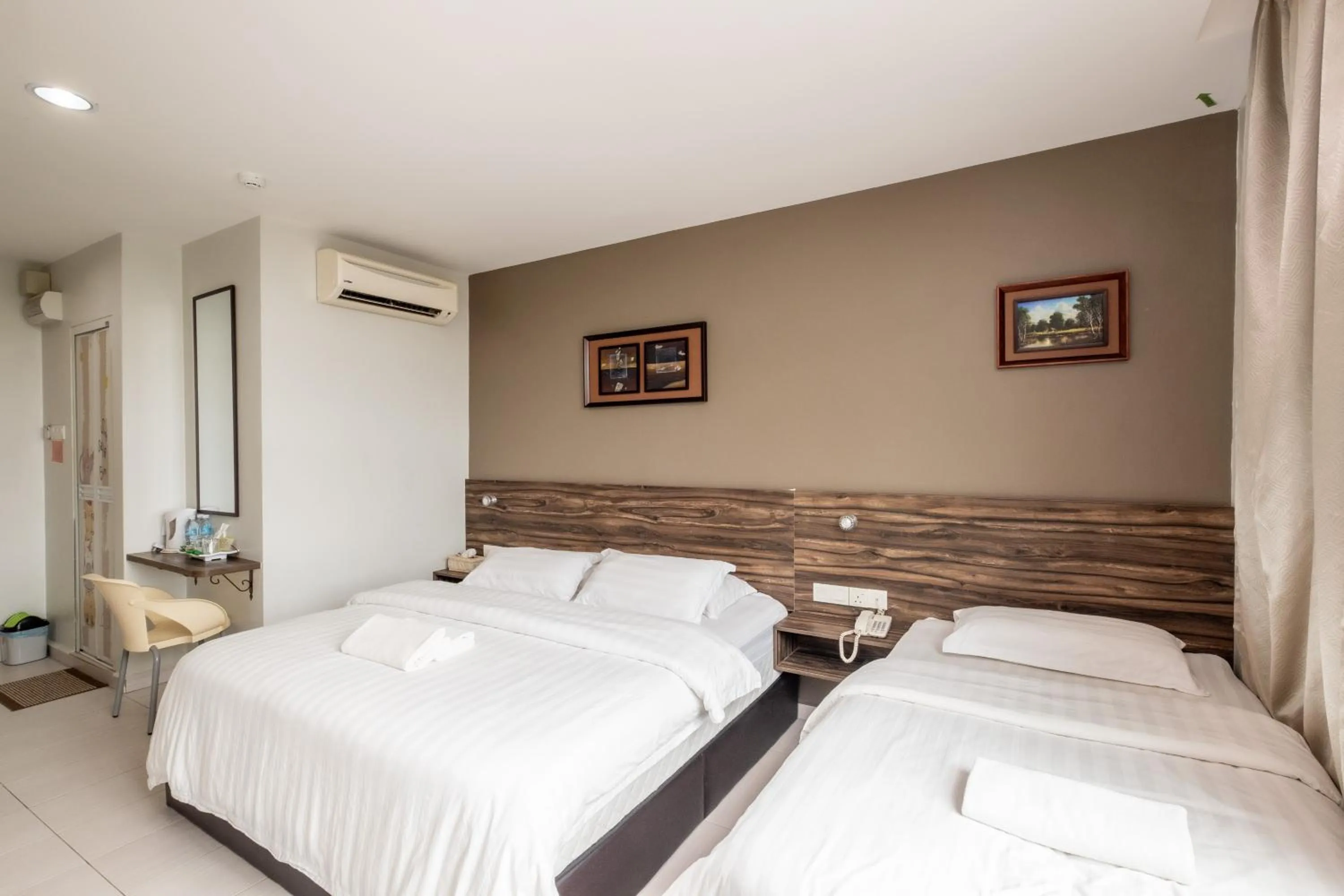 Bed in BG Business Hotel