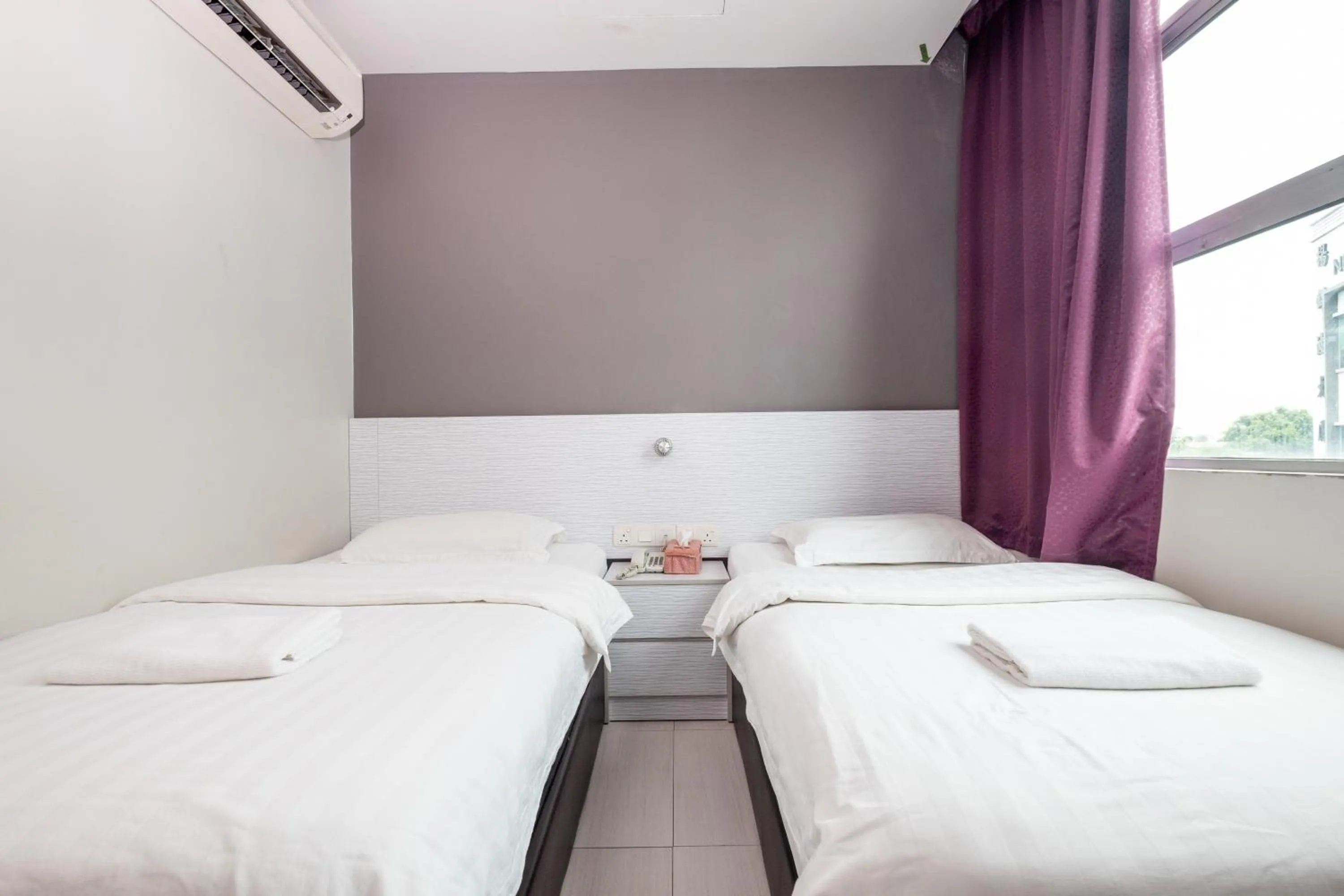 Bed in BG Business Hotel