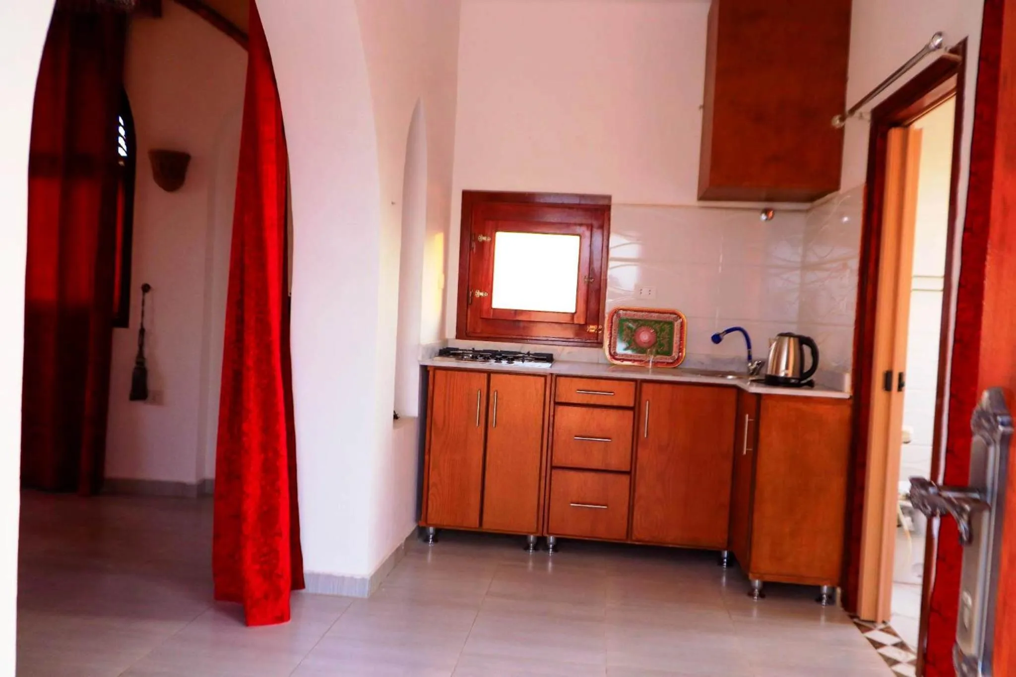 Kitchen or kitchenette in Thebes Hotel