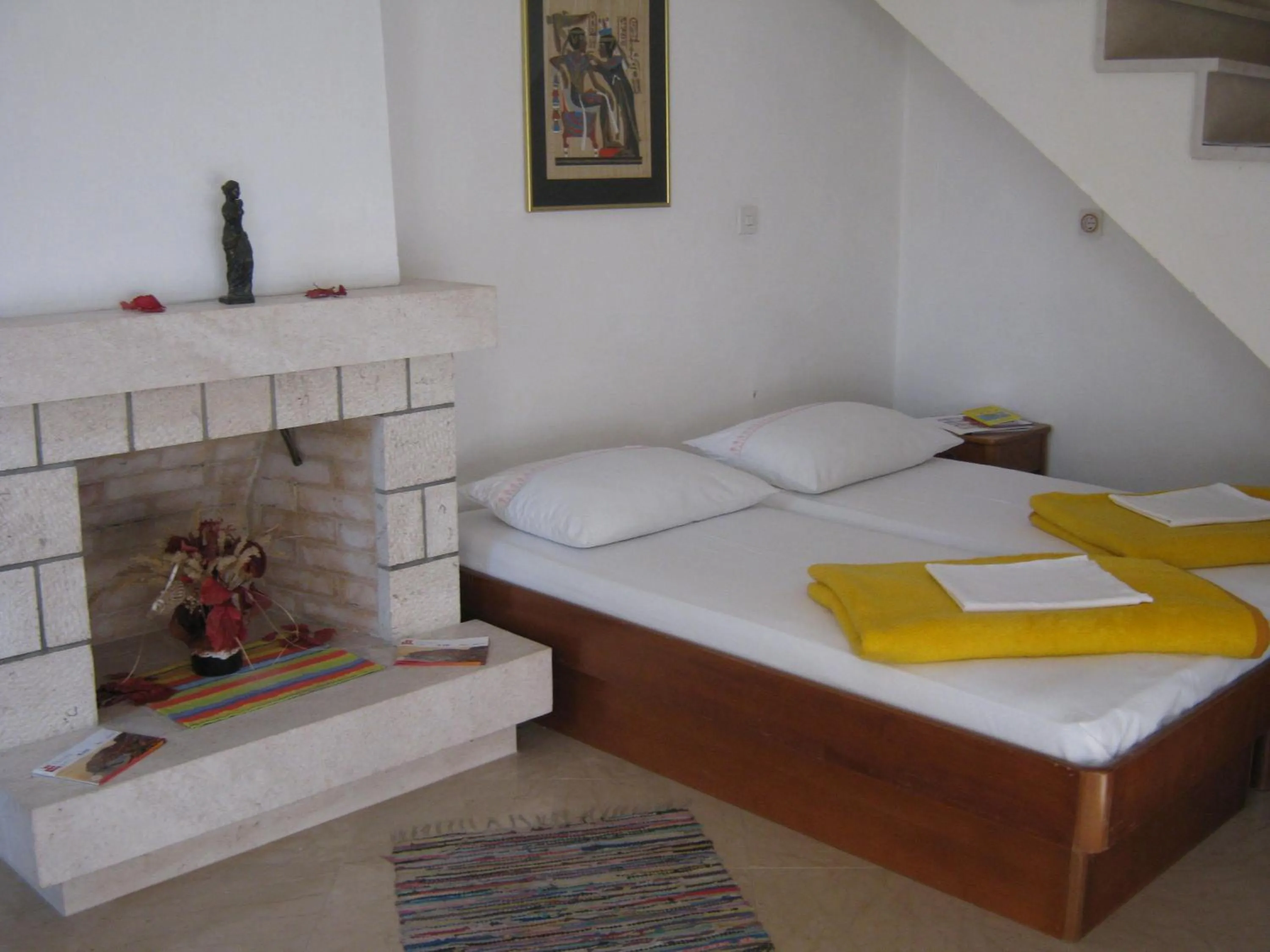 Bed in Apartments and Rooms Artemida