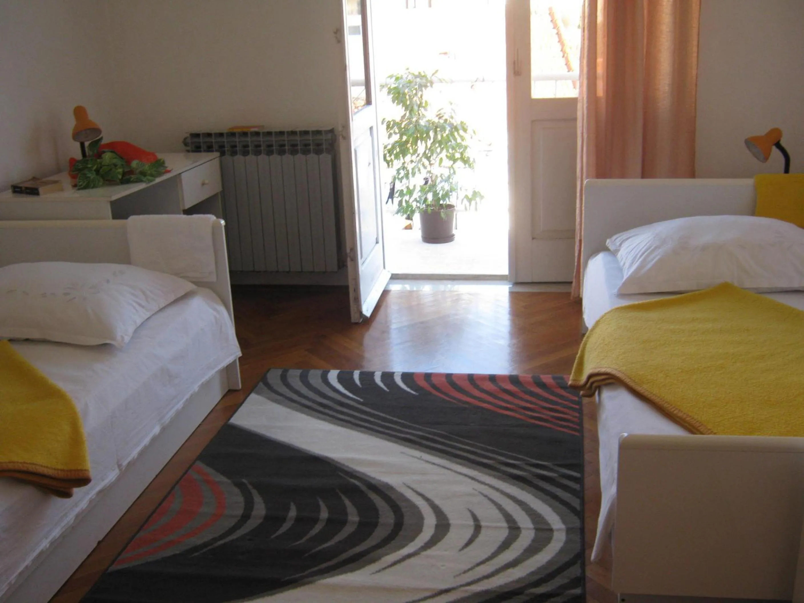 Bed in Apartments and Rooms Artemida
