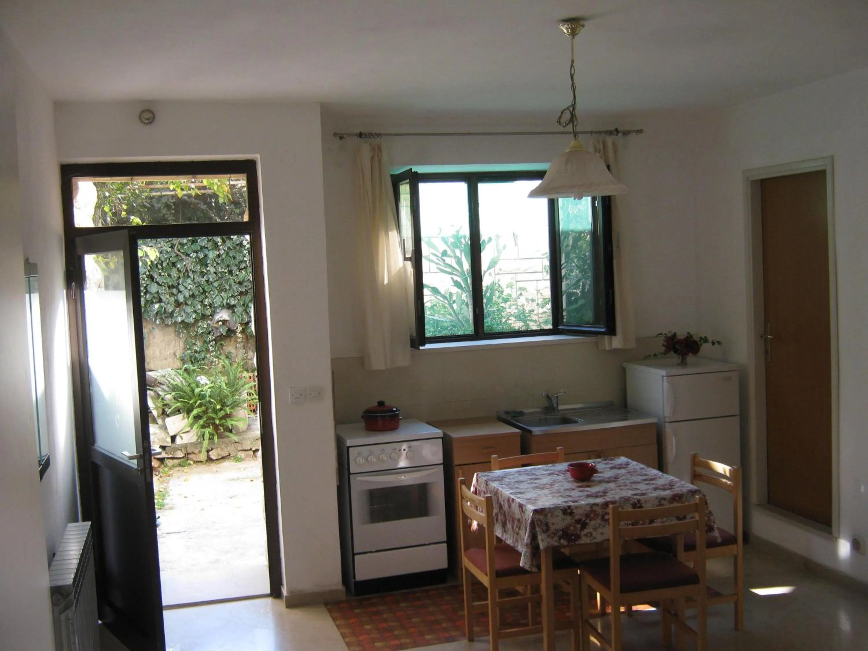 Kitchen or kitchenette in Apartments and Rooms Artemida