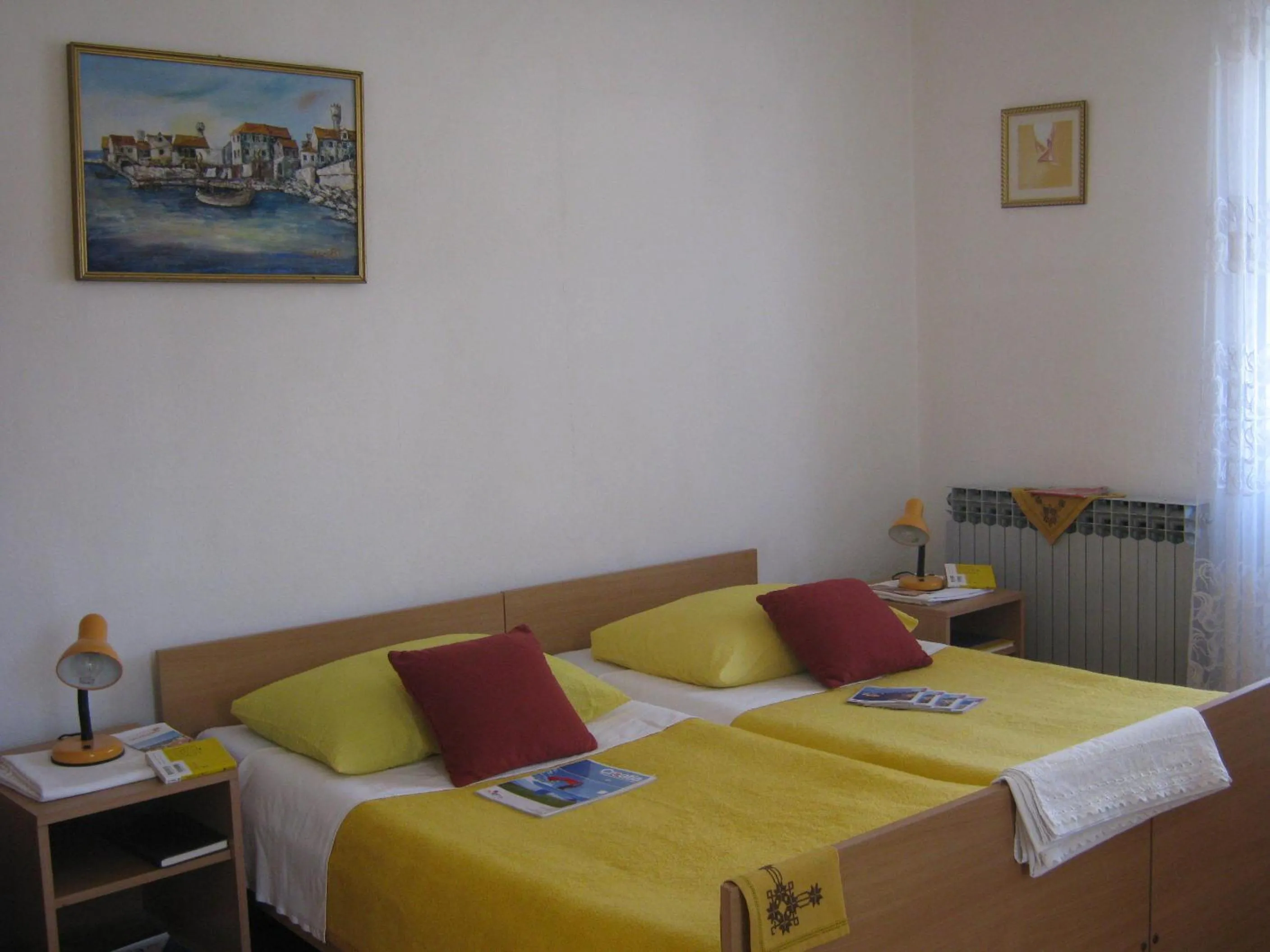 Bed in Apartments and Rooms Artemida