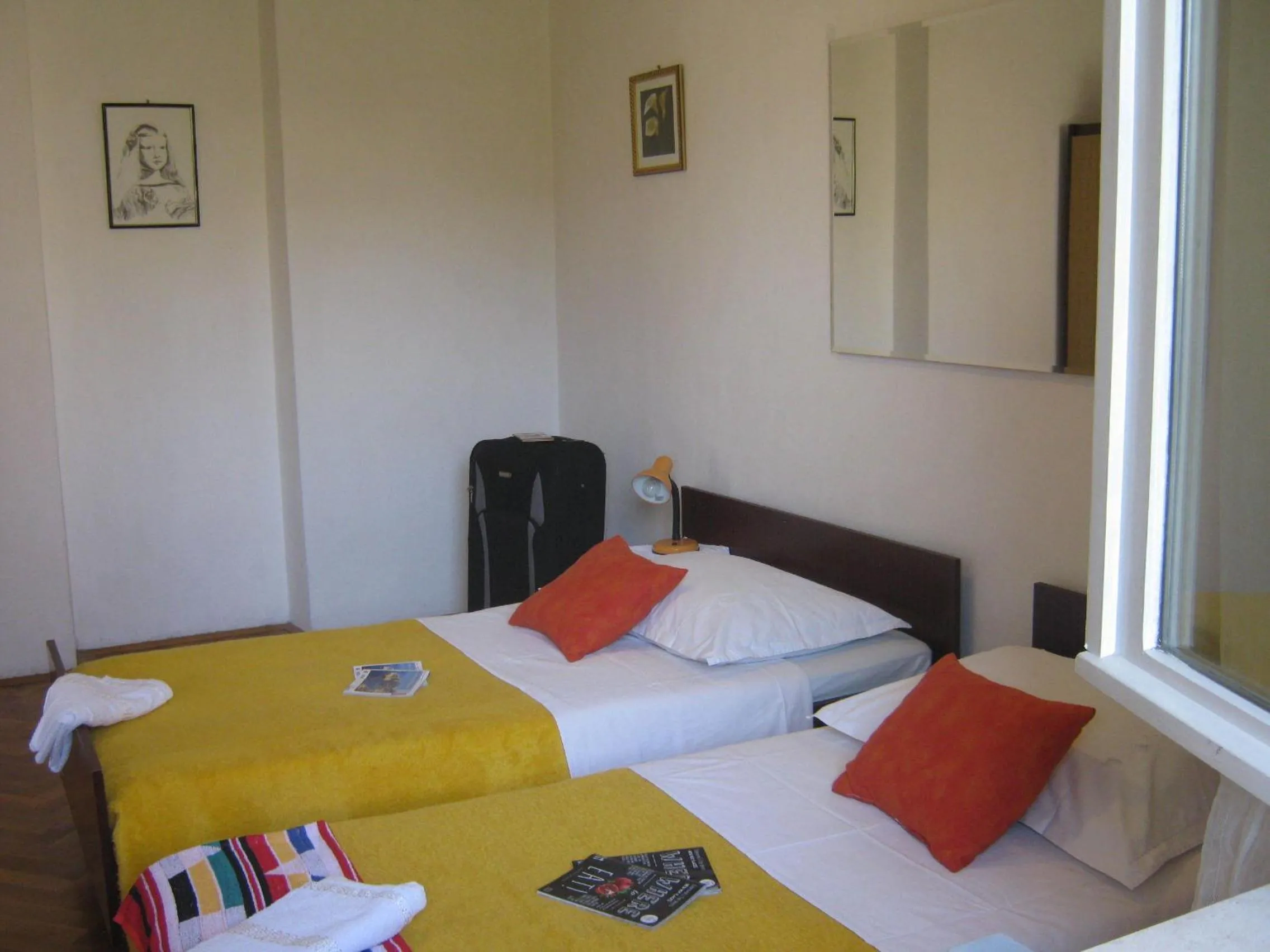Bed in Apartments and Rooms Artemida