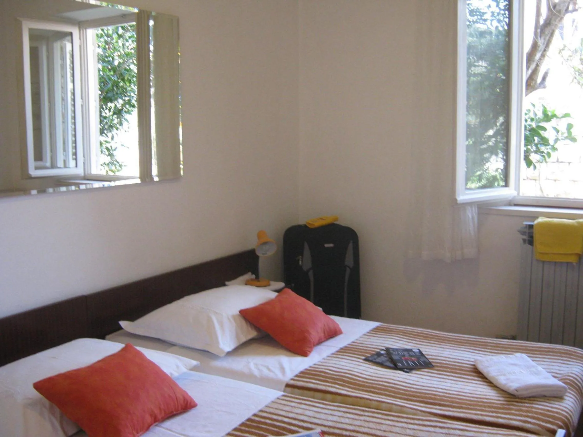 Bed in Apartments and Rooms Artemida