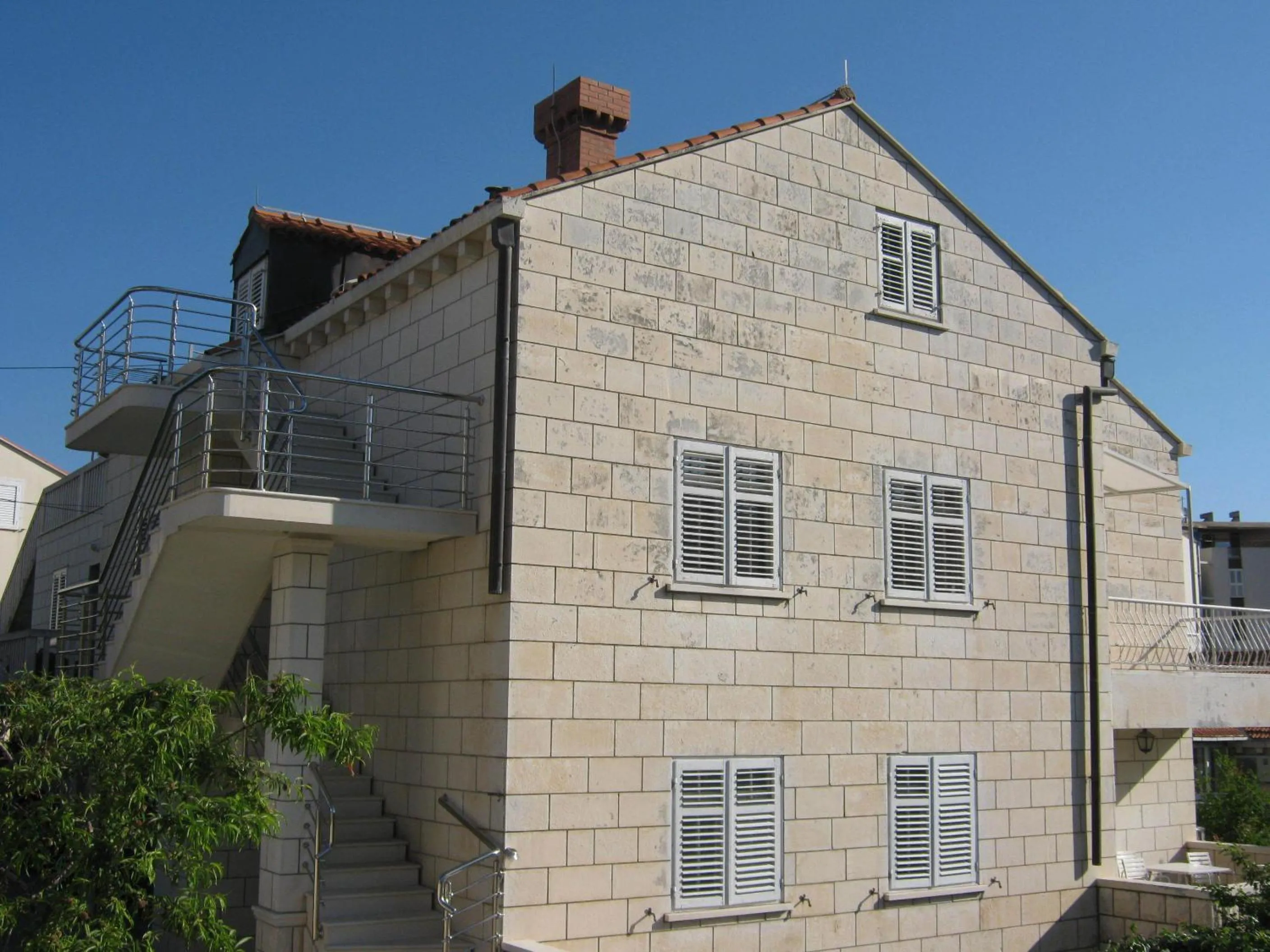 Property building in Apartments and Rooms Artemida
