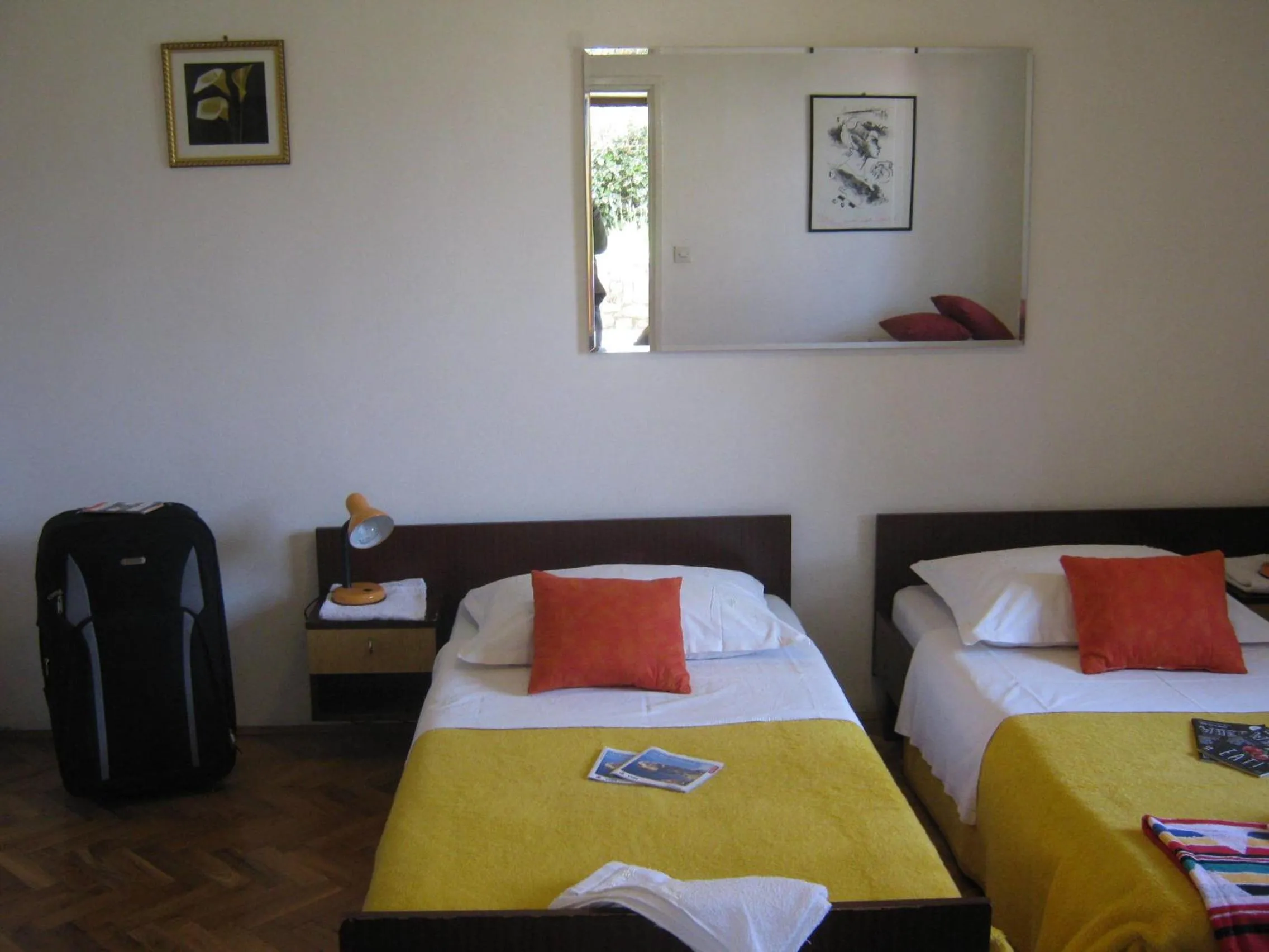 Bed in Apartments and Rooms Artemida