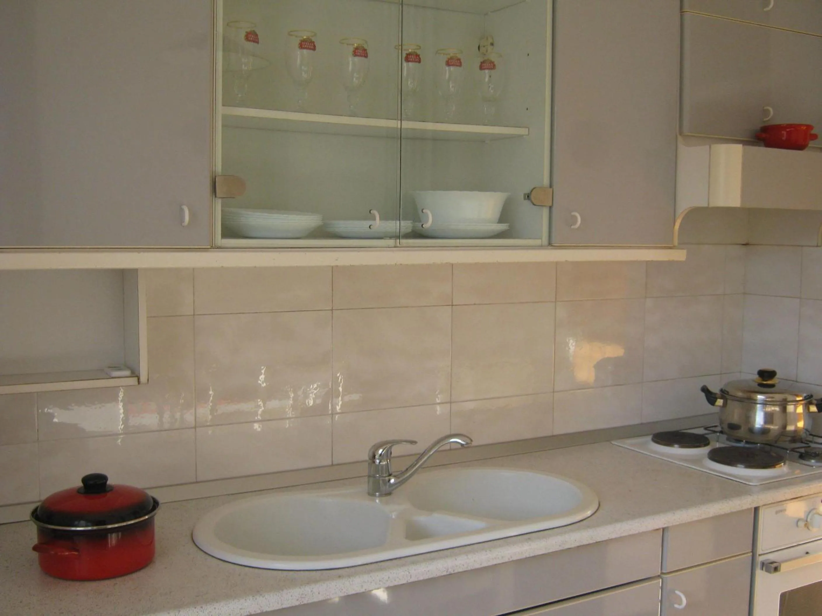 Kitchen or kitchenette in Apartments and Rooms Artemida