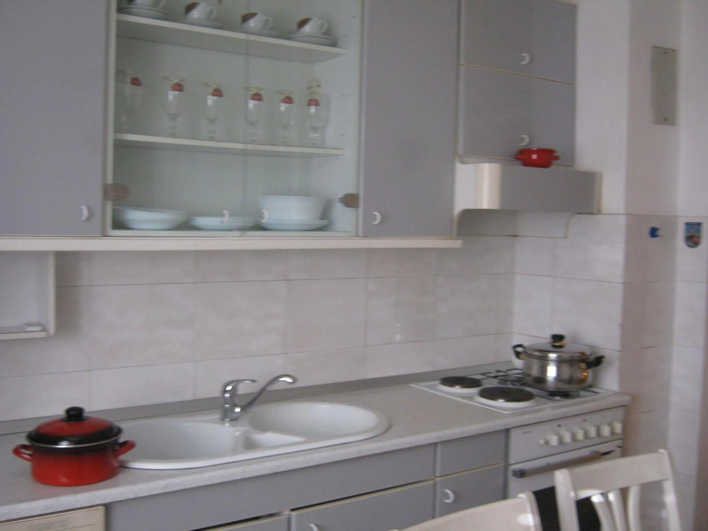 Kitchen or kitchenette in Apartments and Rooms Artemida