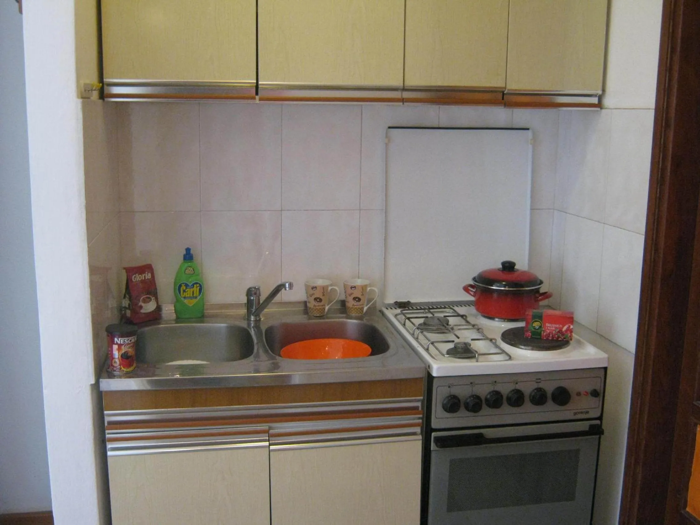 Kitchen or kitchenette in Apartments and Rooms Artemida