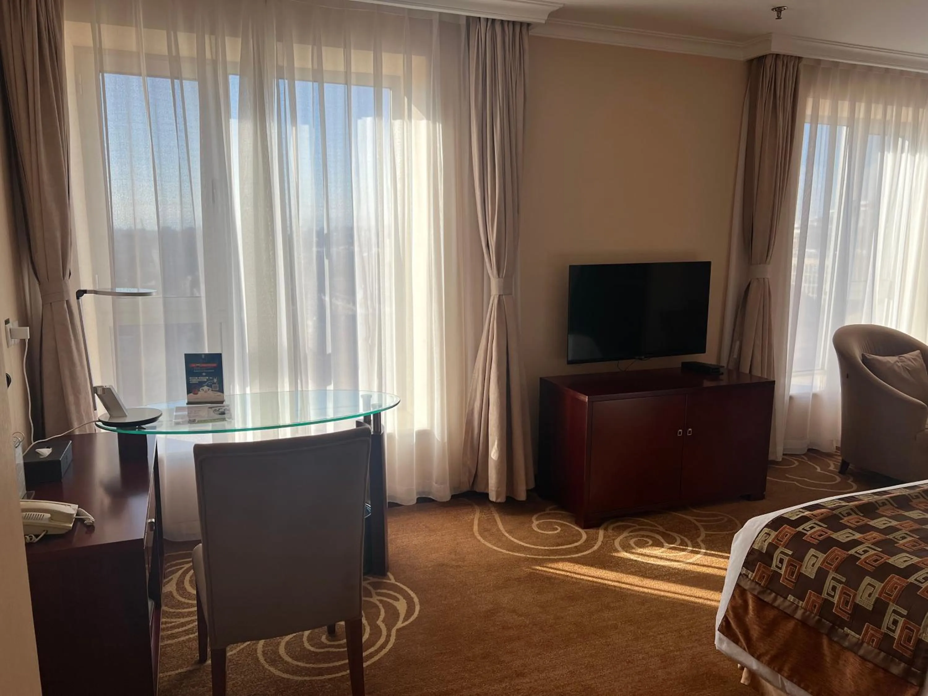 Seating area, Bed in Inner Mongolia Grand Hotel