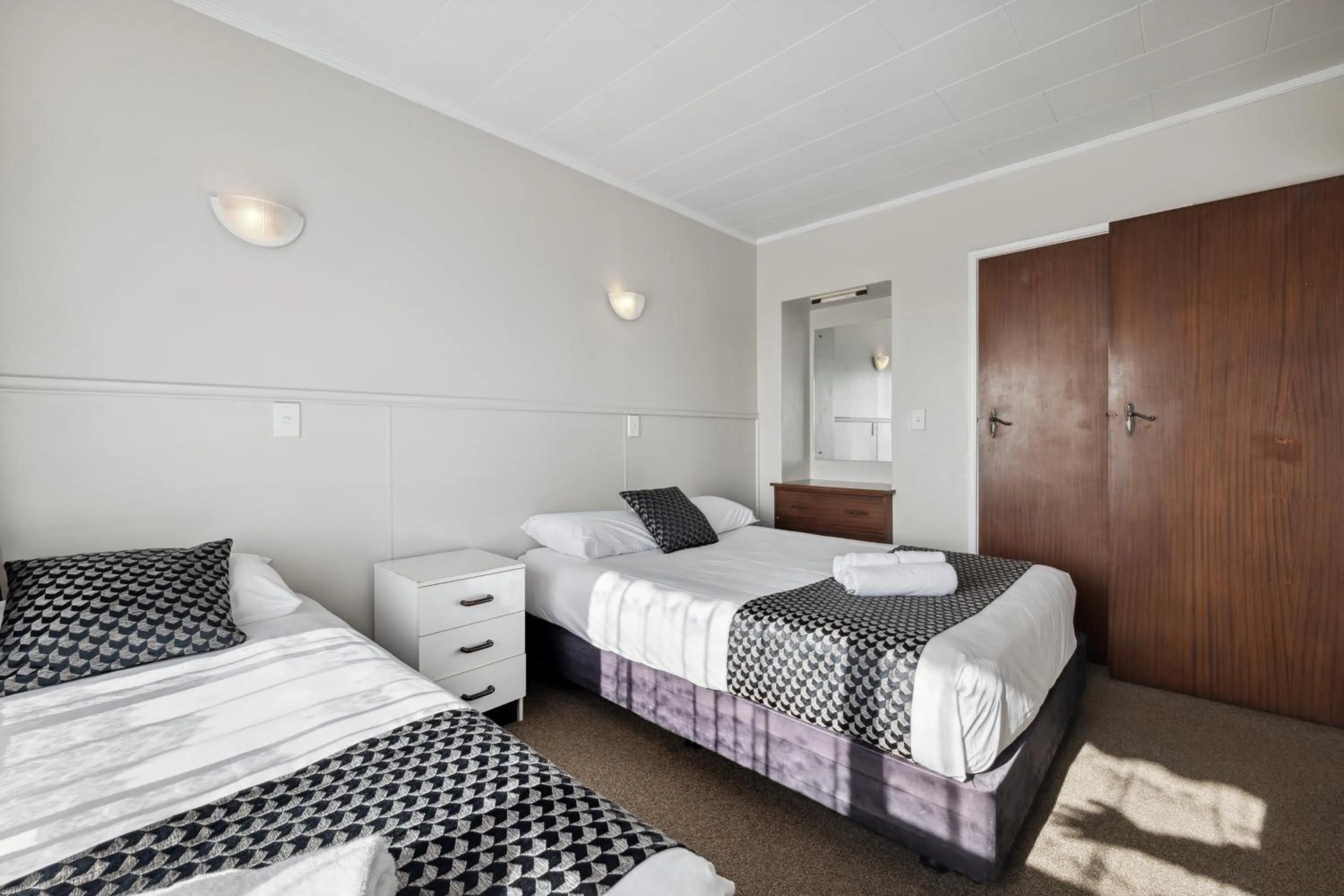 Bed in Flamingo Motel