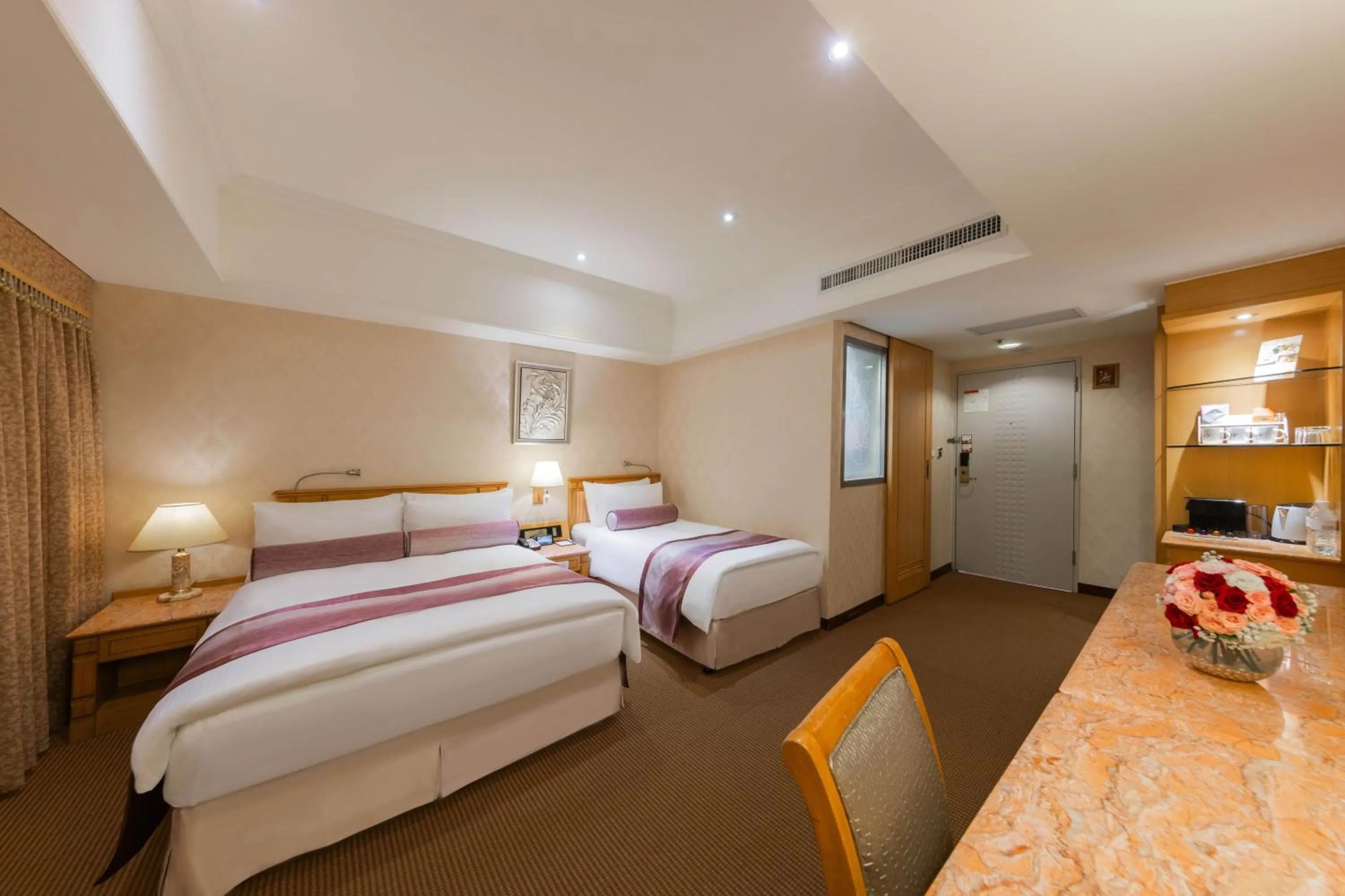 Photo of the whole room, Bed in Cosmos Hotel Taipei