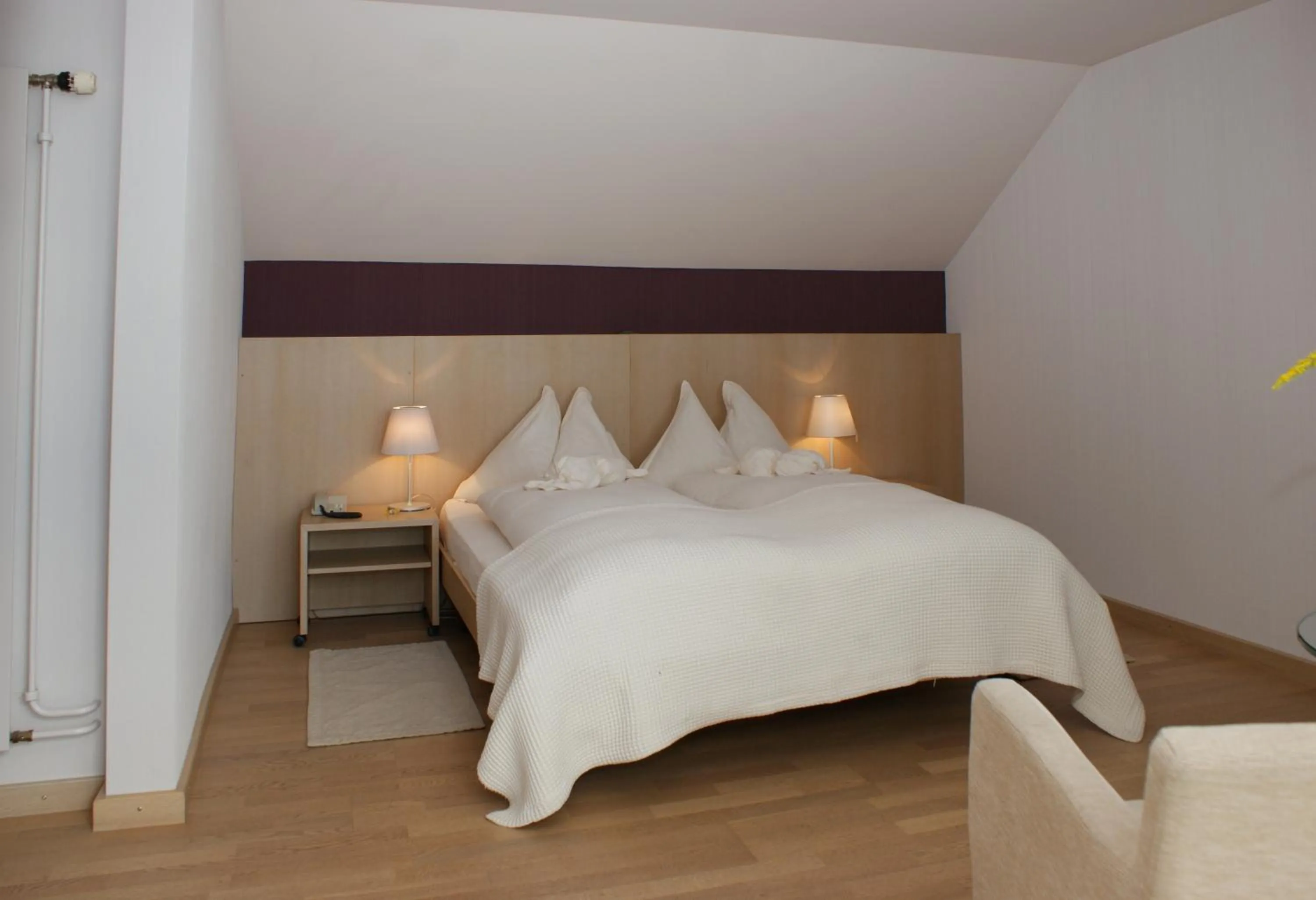 Bed in Hotel Jean-Jacques Rousseau