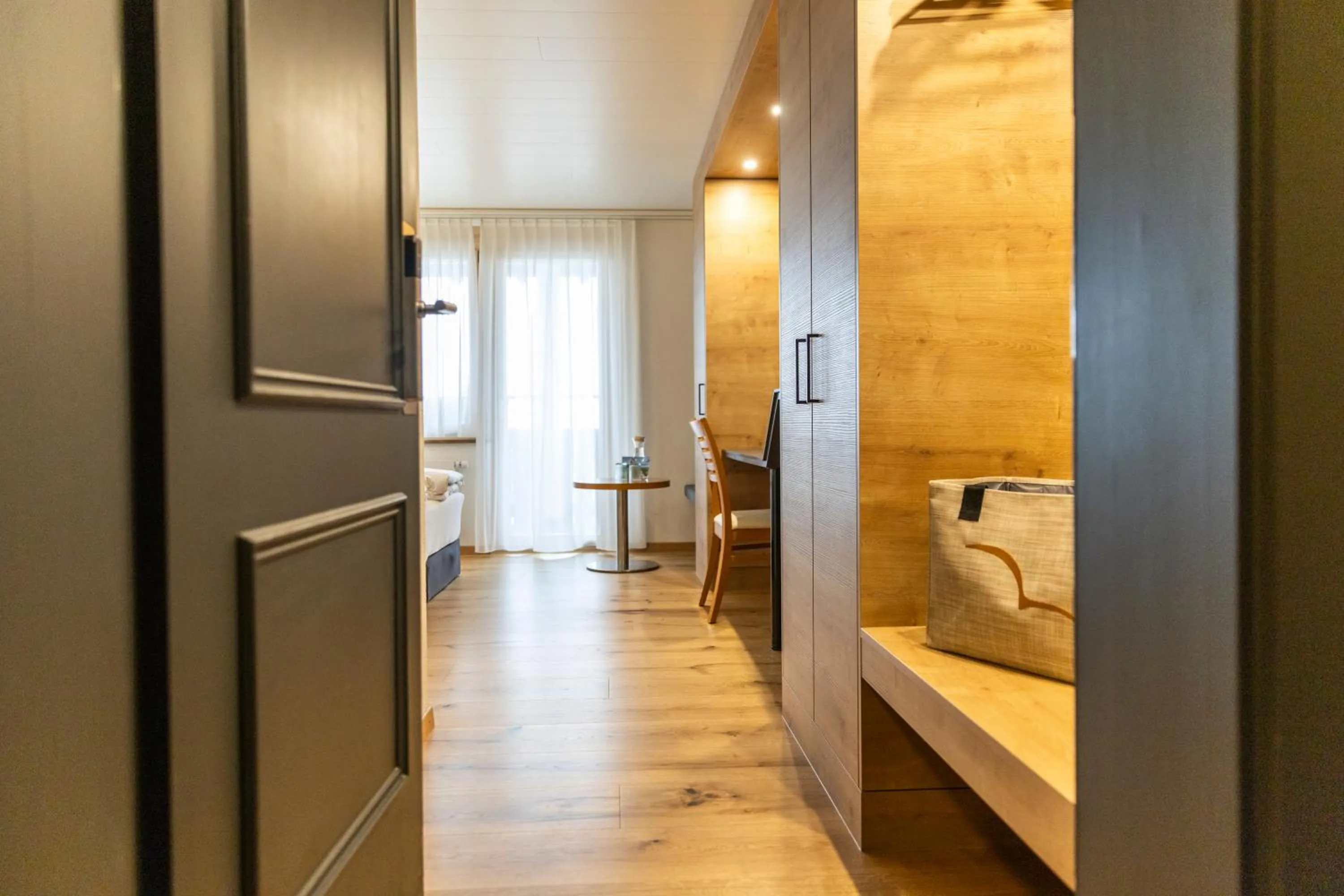 wardrobe, Bed in Seemöwe Wellnesshotel Swiss Quality