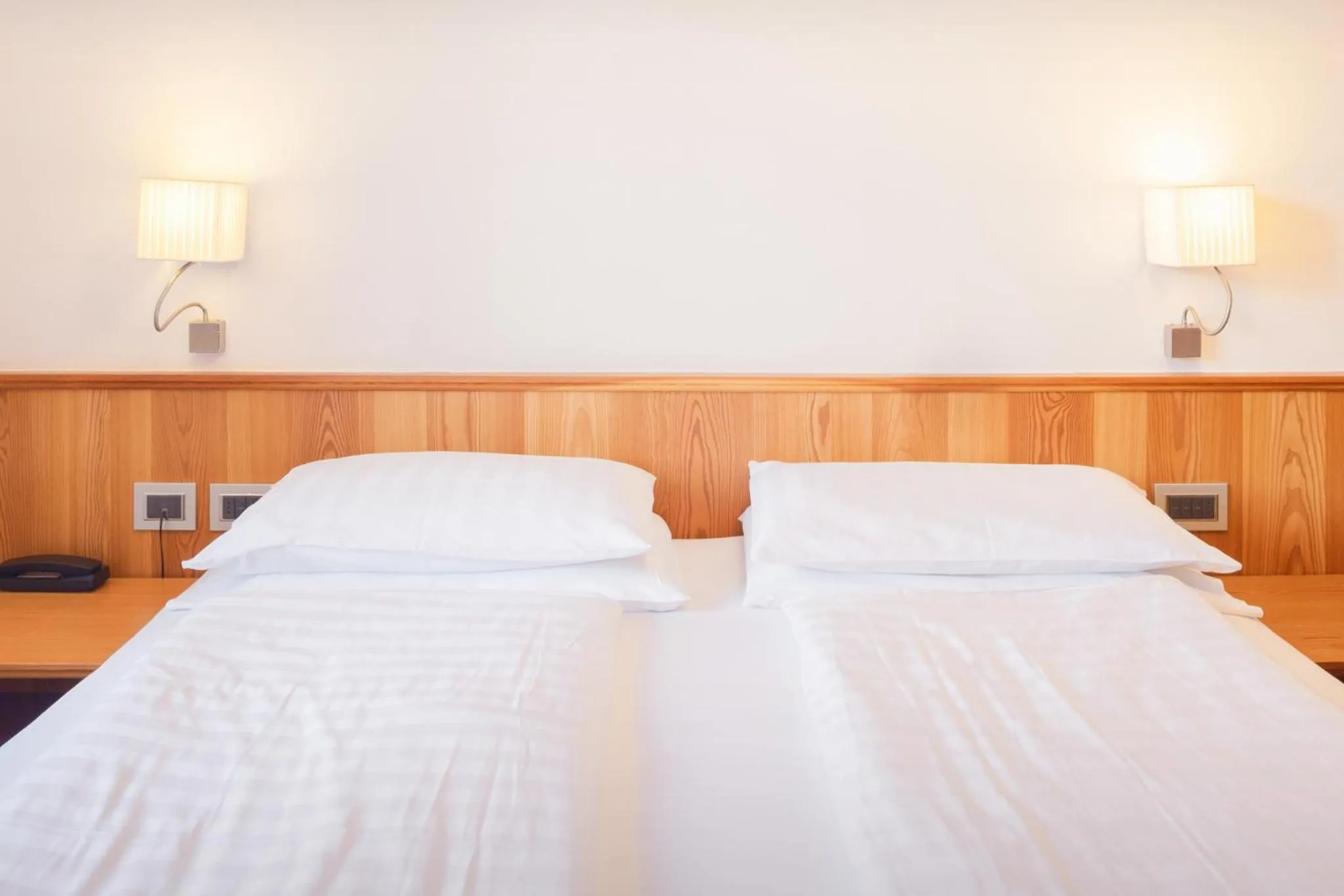 Bed in Family Hotel Serena