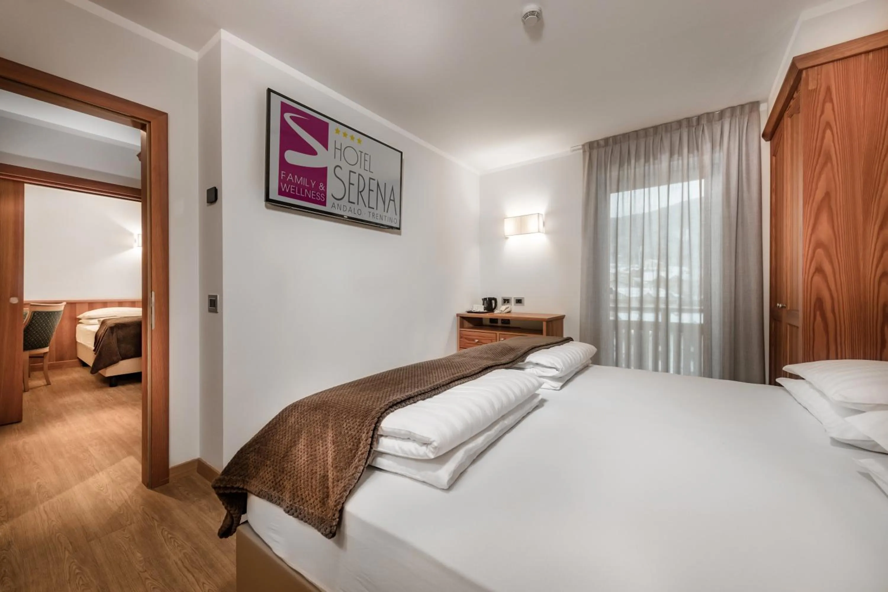 Bed in Family Hotel Serena