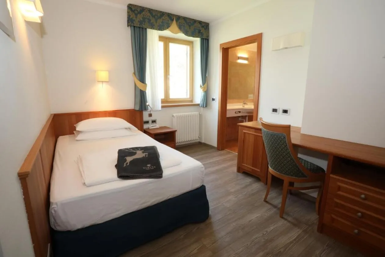 Bed in Family Hotel Serena