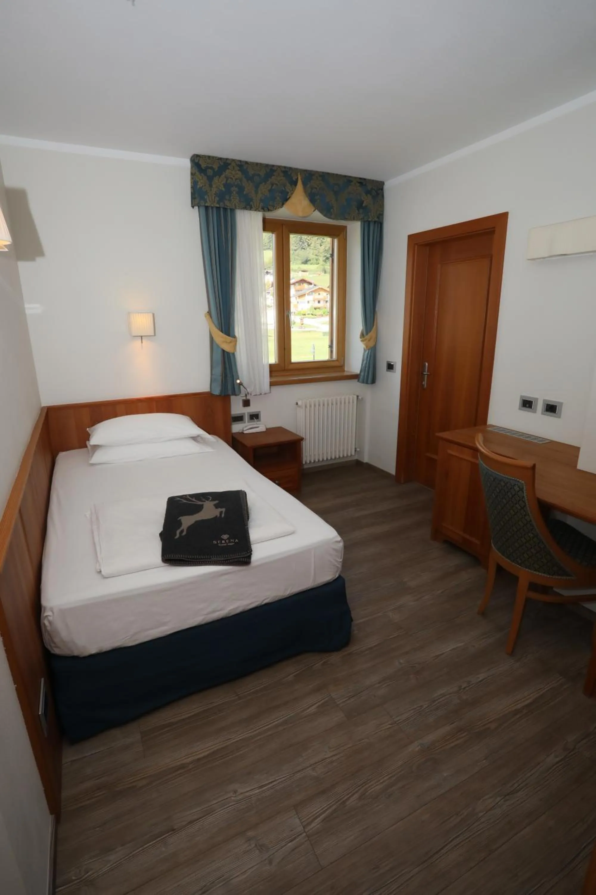 Bed in Family Hotel Serena