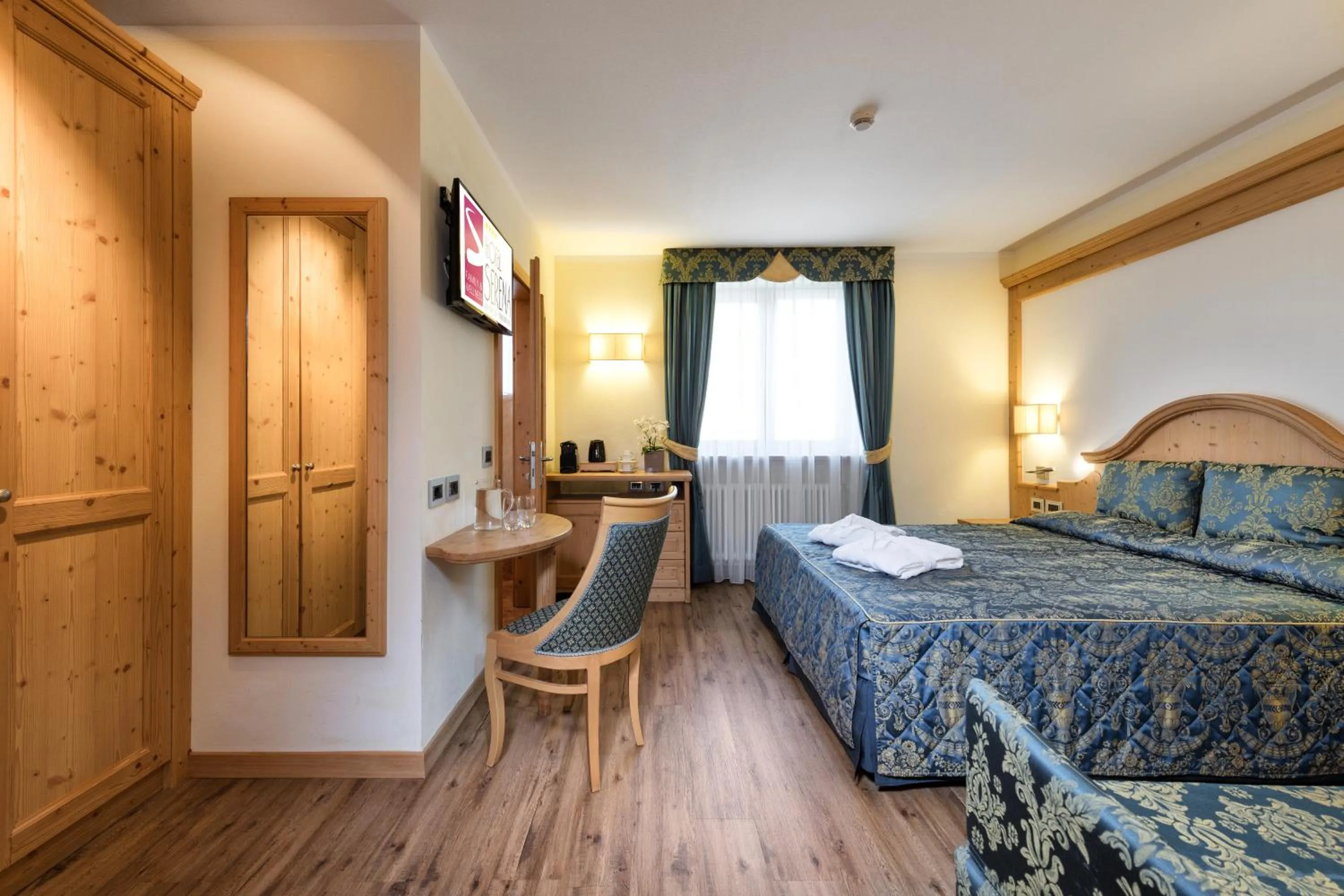 Bed in Family Hotel Serena