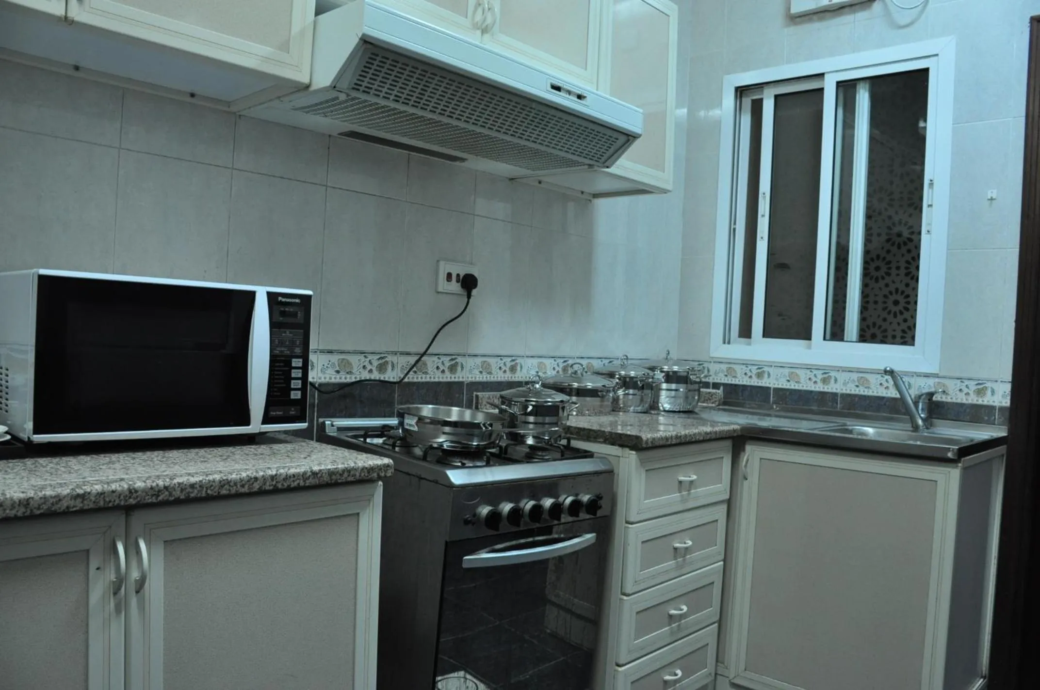 Kitchen or kitchenette in Sahara Hotel Apartments