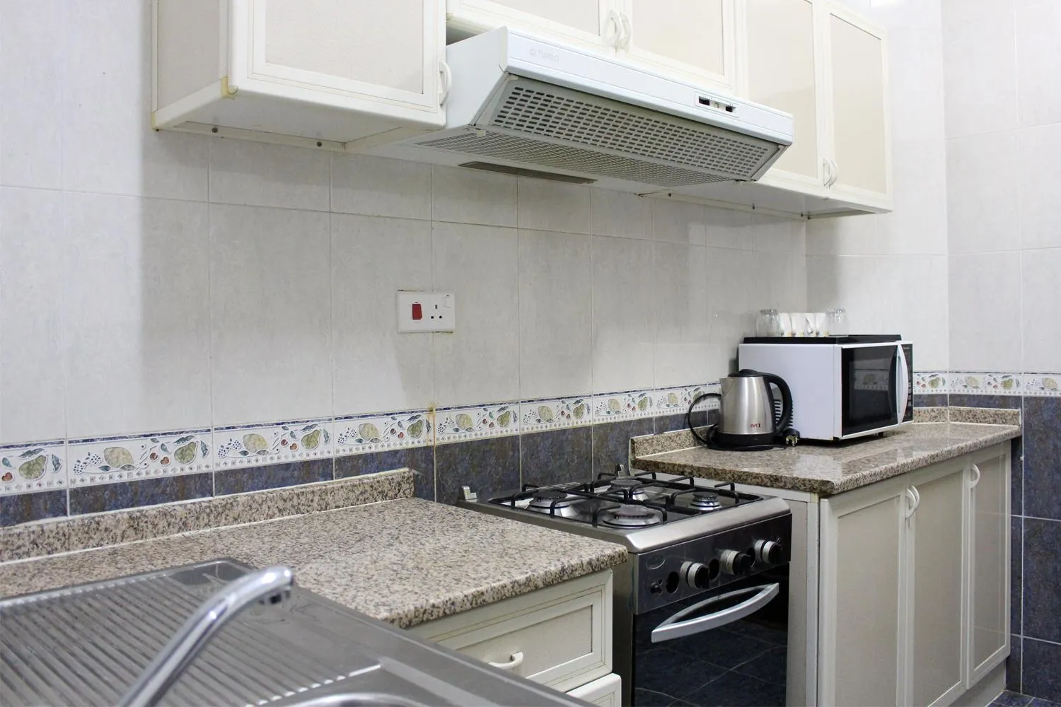 Kitchen or kitchenette in Sahara Hotel Apartments