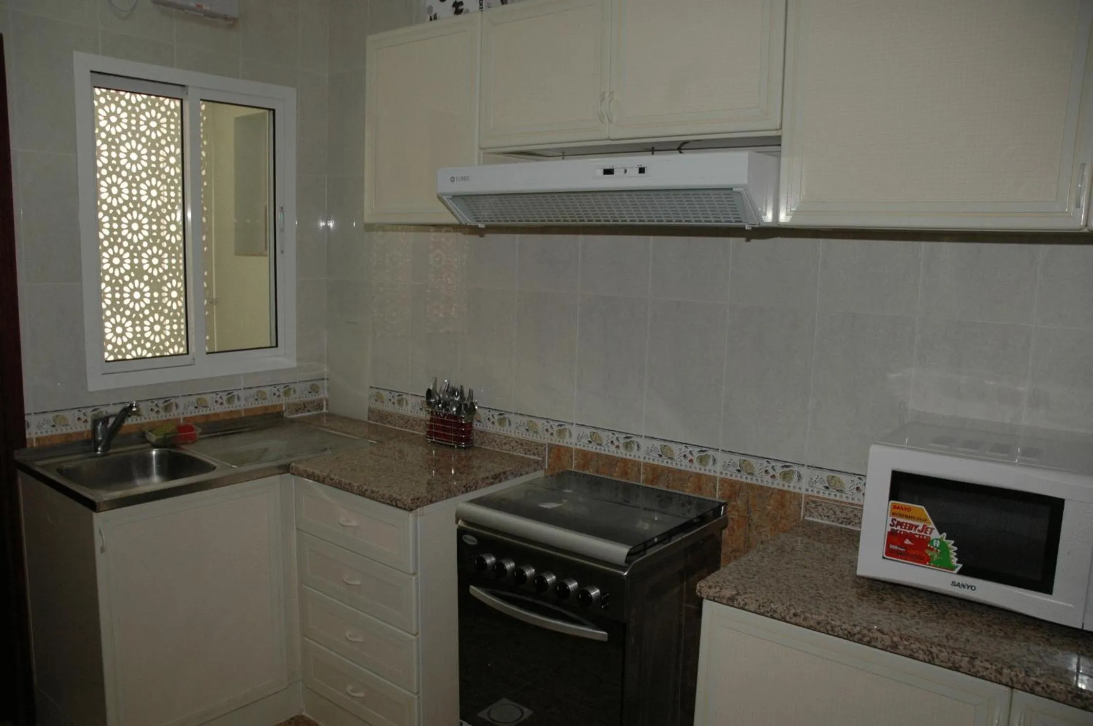 Kitchen or kitchenette in Sahara Hotel Apartments
