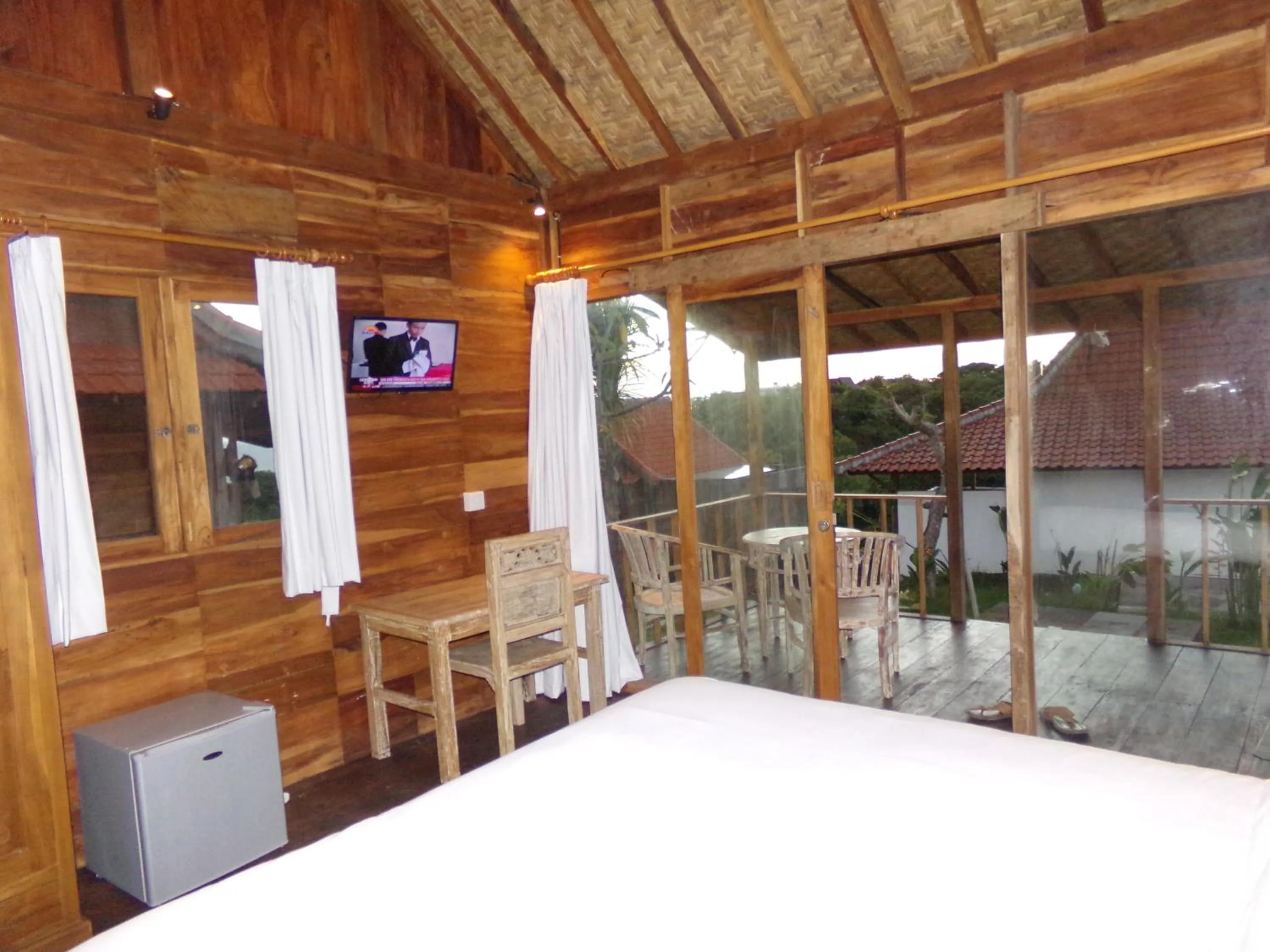 Bed in Green Bowl Beach Villas