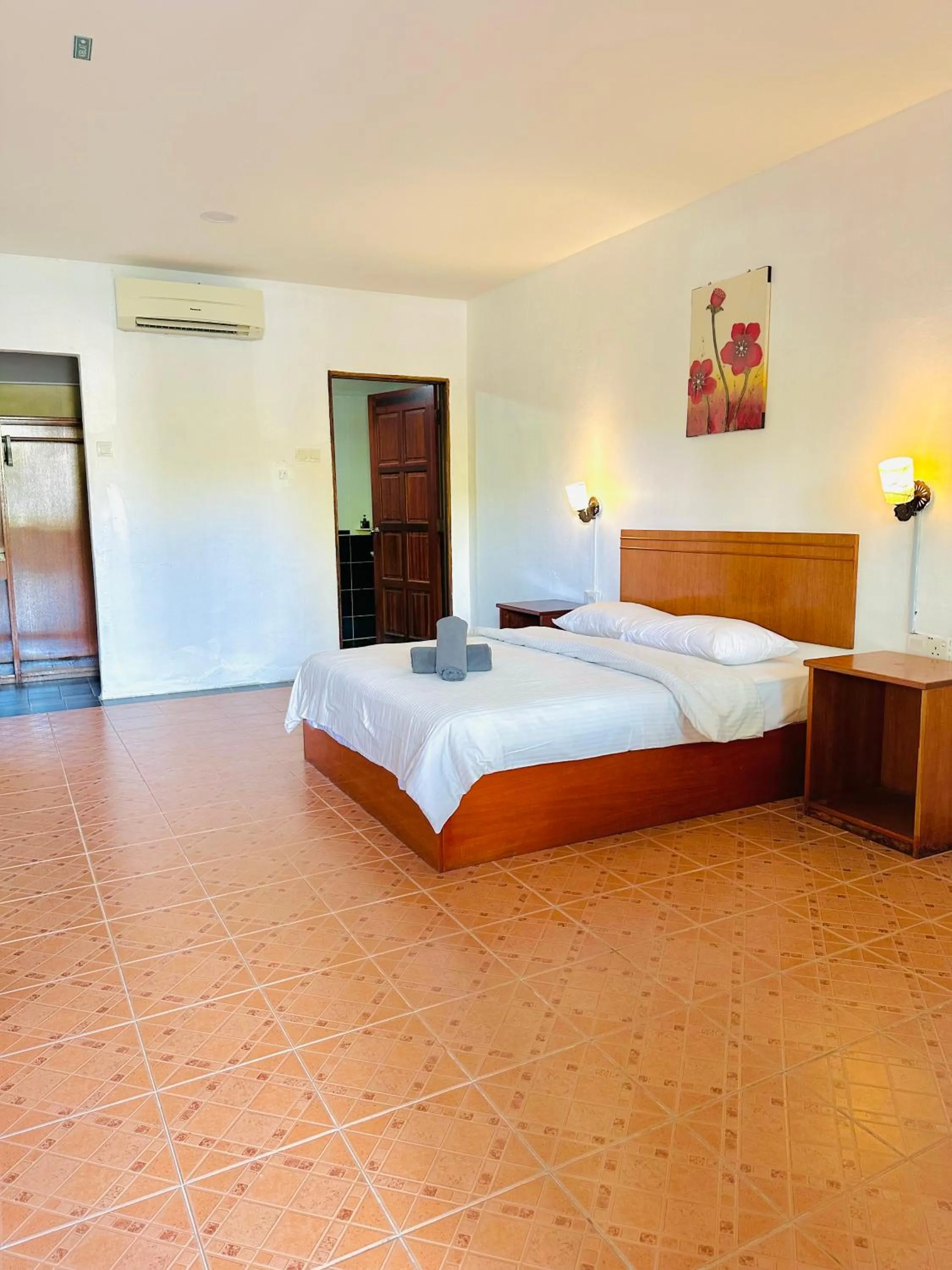 Bed in Landcons Hotel & Resort