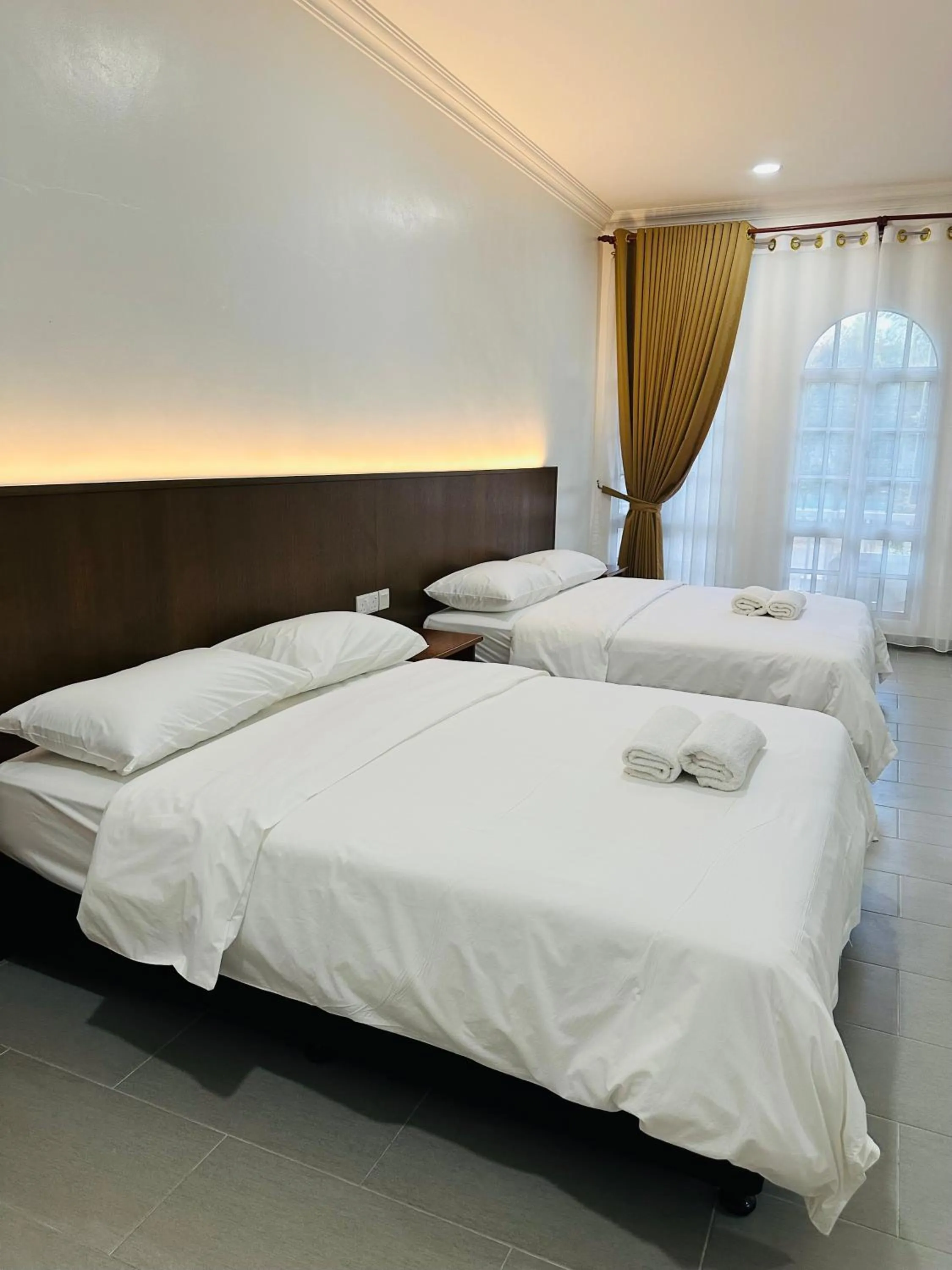 Bed in Landcons Hotel & Resort