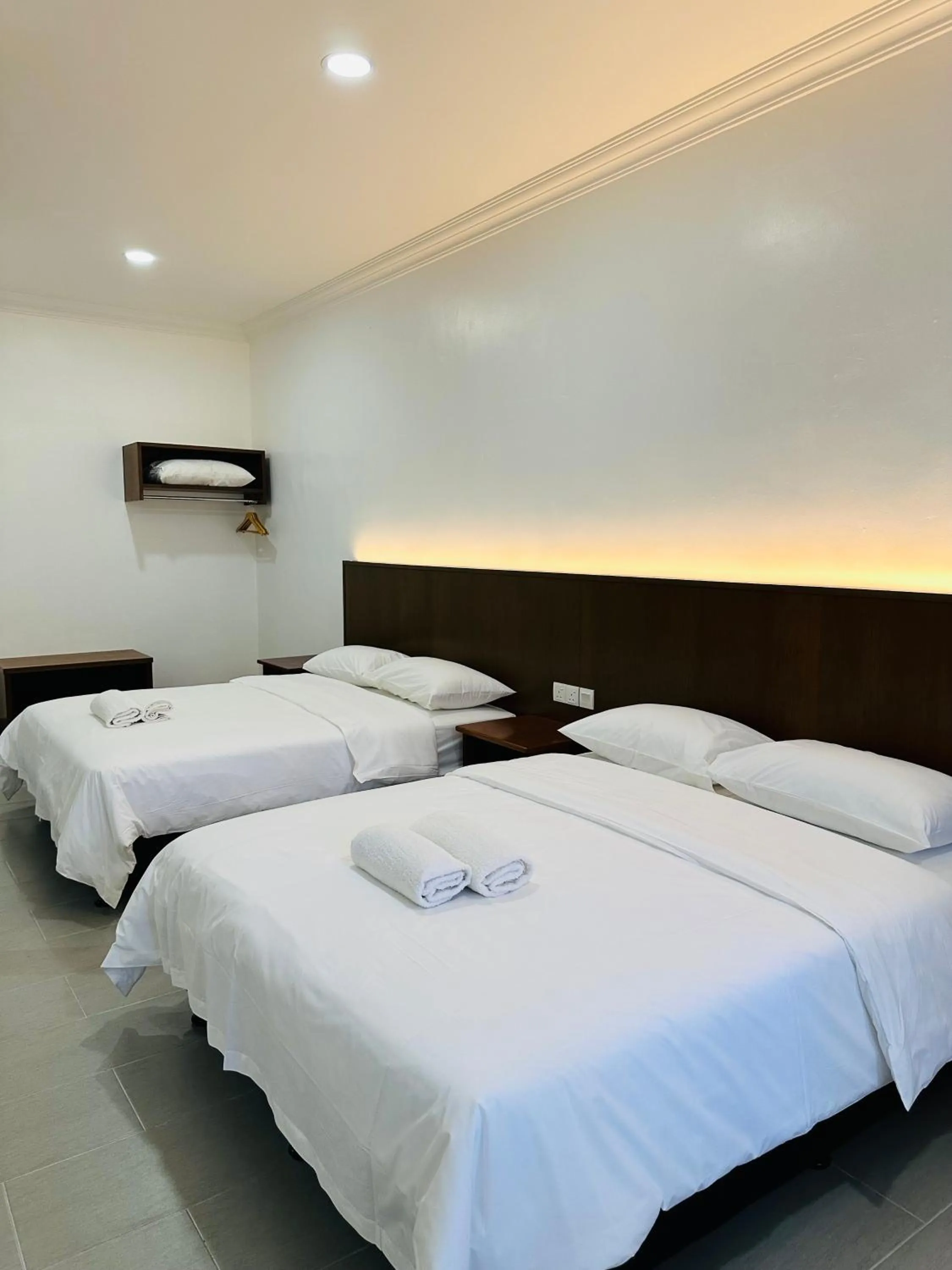 Bed in Landcons Hotel & Resort
