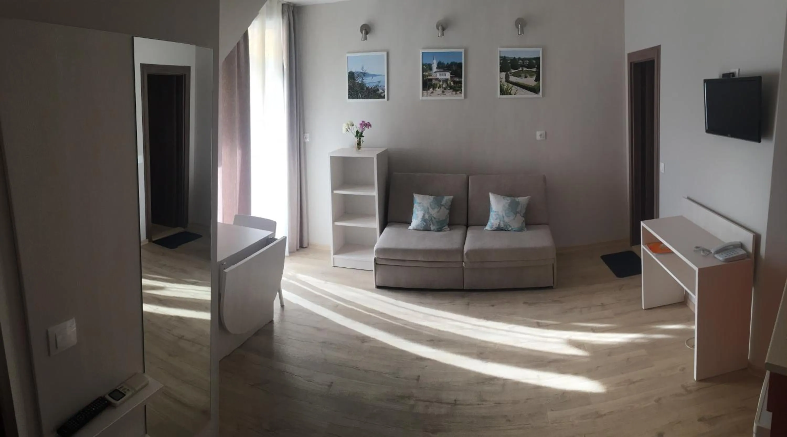 Living room, Bed in Helios Hotel