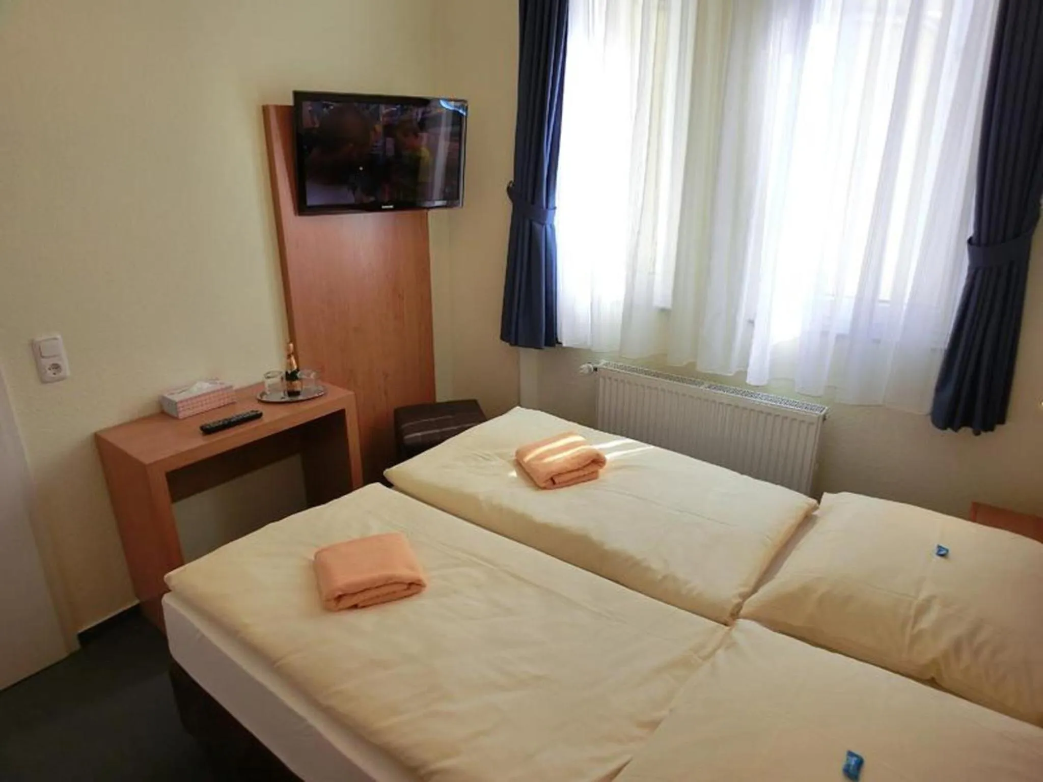 Photo of the whole room, Bed in Hotel Expo Frankfurt City Centre - Self Check-In