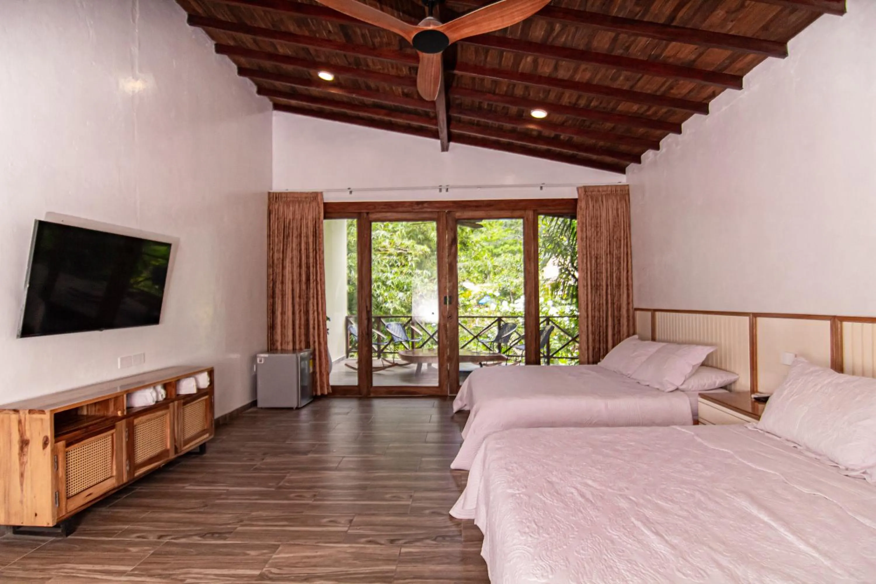 Photo of the whole room, Bed in Portales del Tayrona Garden Hotel