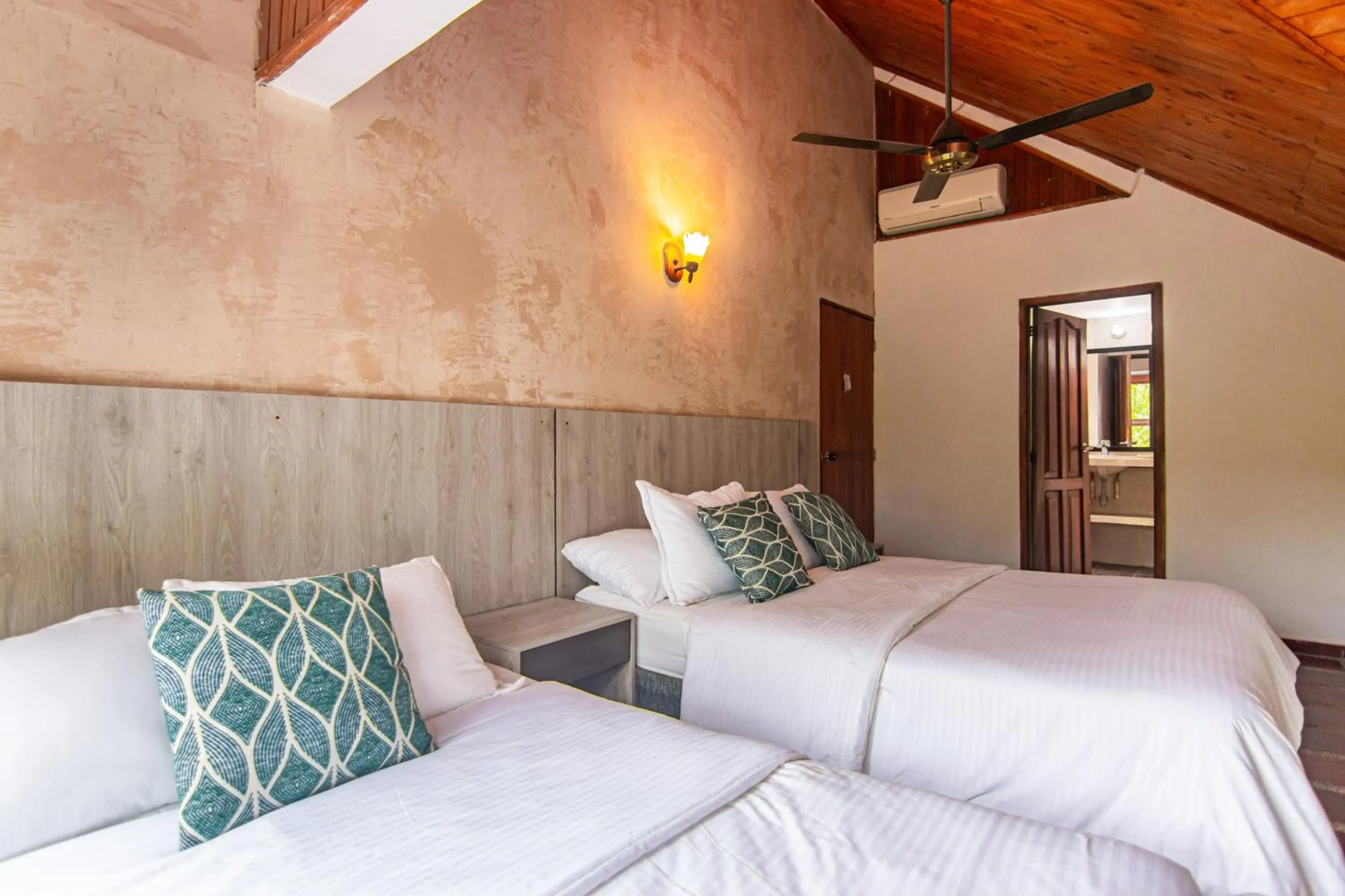 Photo of the whole room, Bed in Portales del Tayrona Garden Hotel