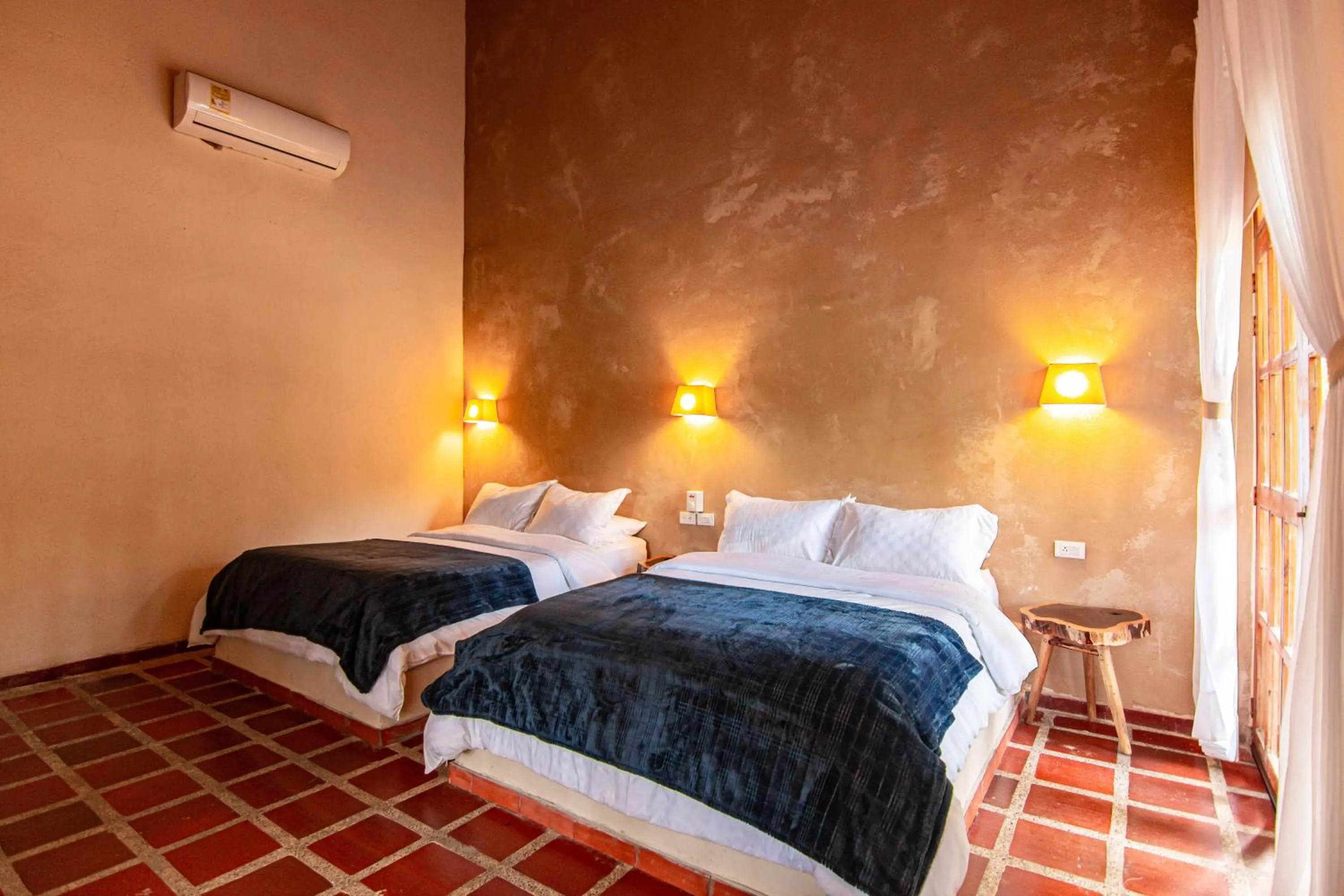 Bed in Portales del Tayrona Garden Hotel