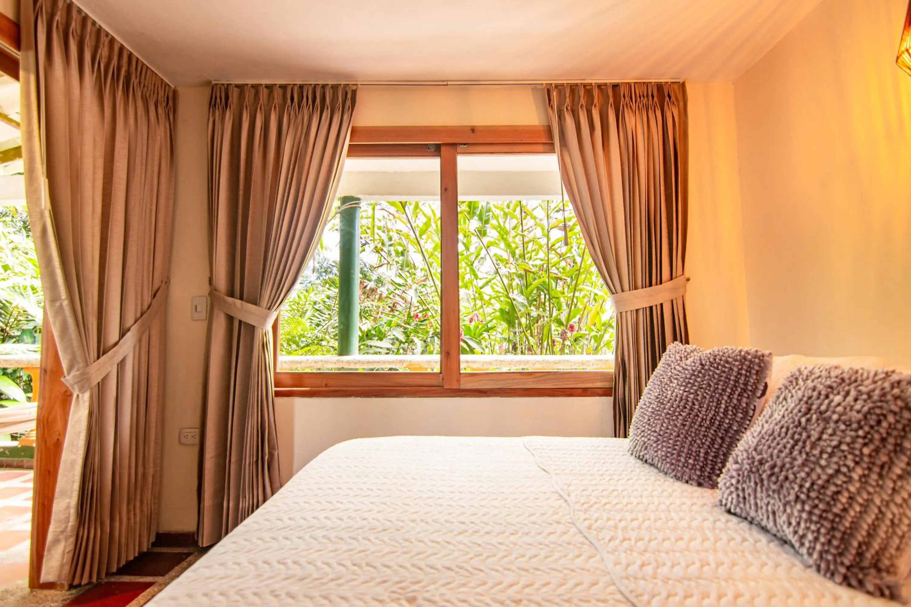 Bed in Portales del Tayrona Garden Hotel