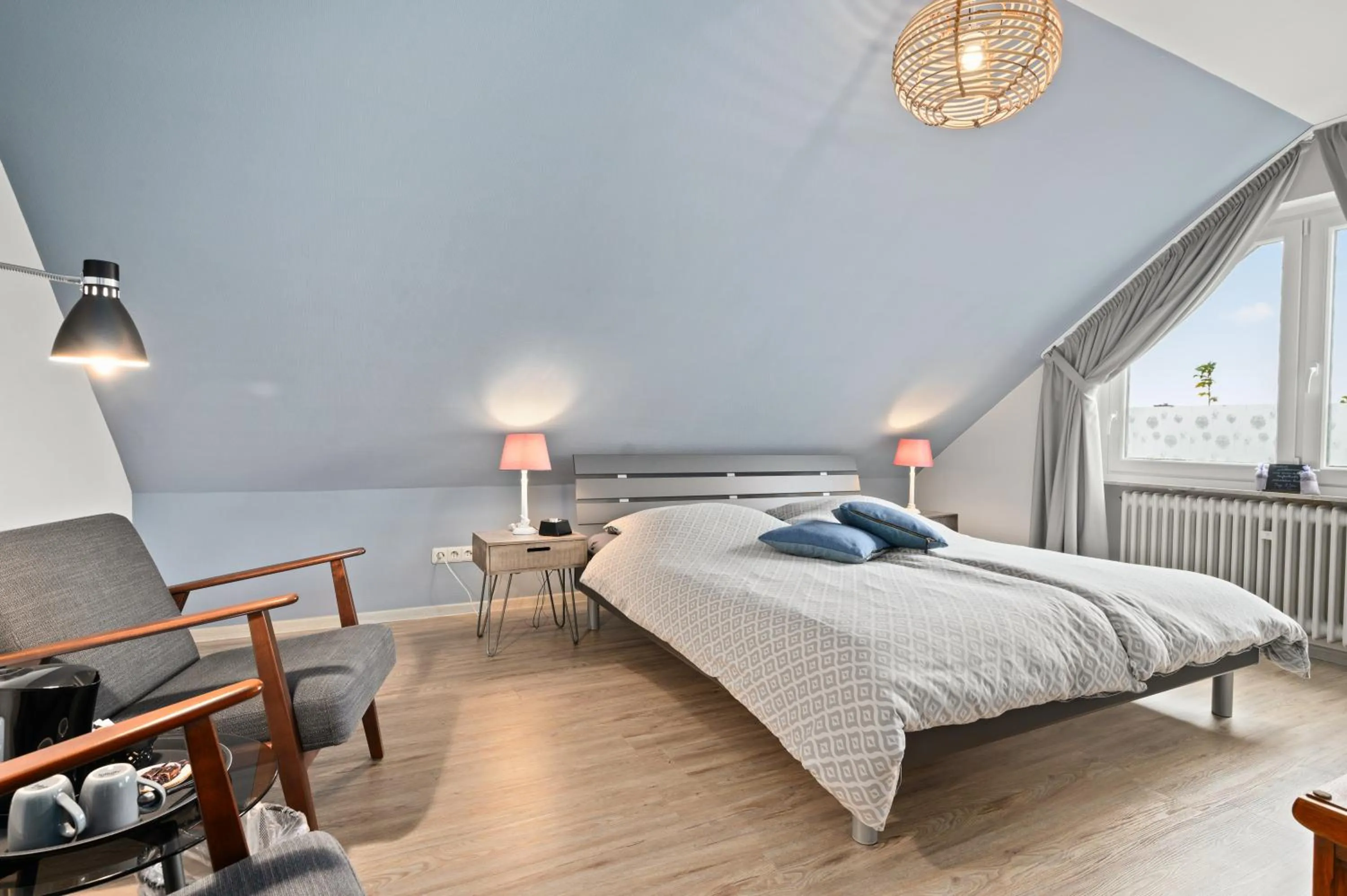 Seating area, Bed in Gästehaus Hoxel