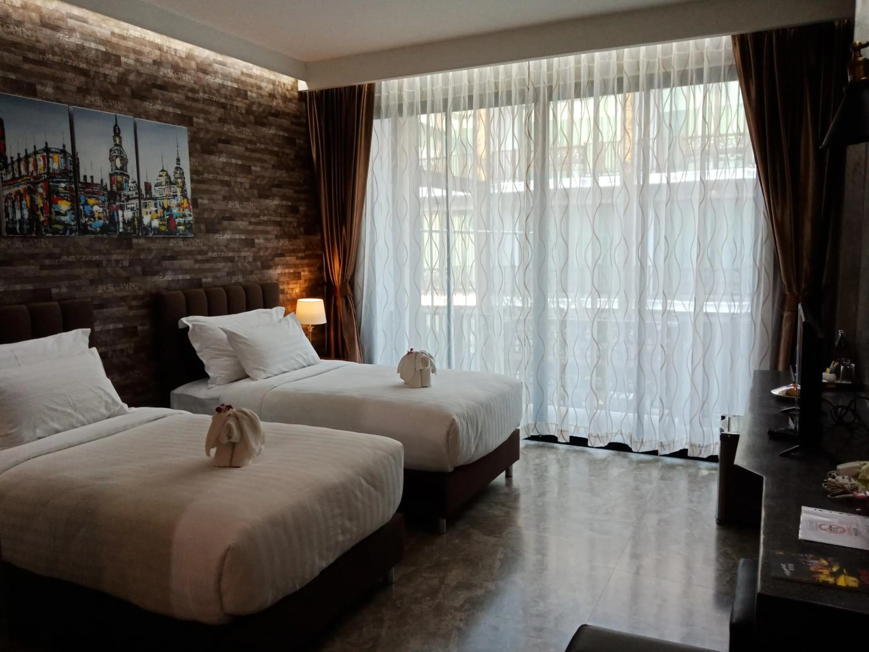 Photo of the whole room, Bed in Namthong Nan Hotel