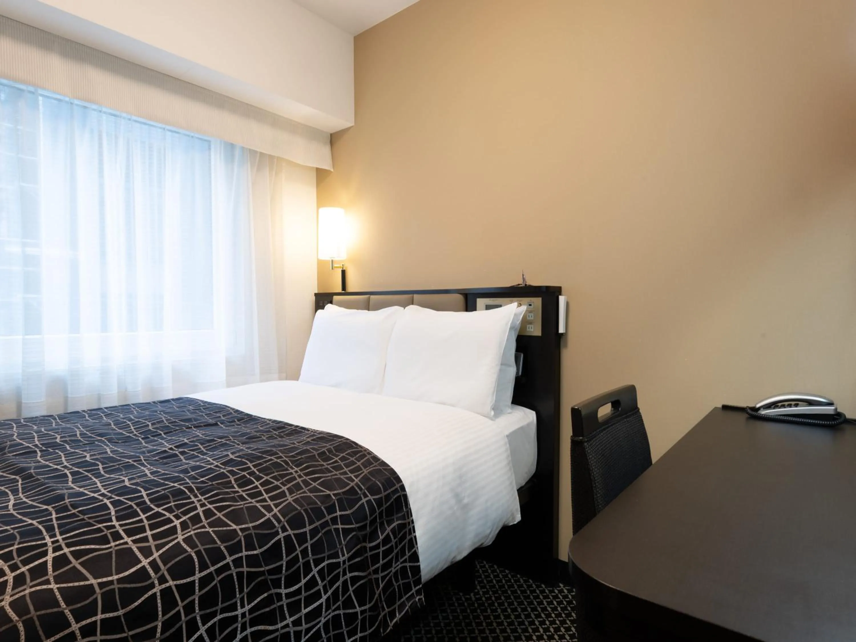 Photo of the whole room, Bed in APA Hotel Shin Osaka Ekiminami