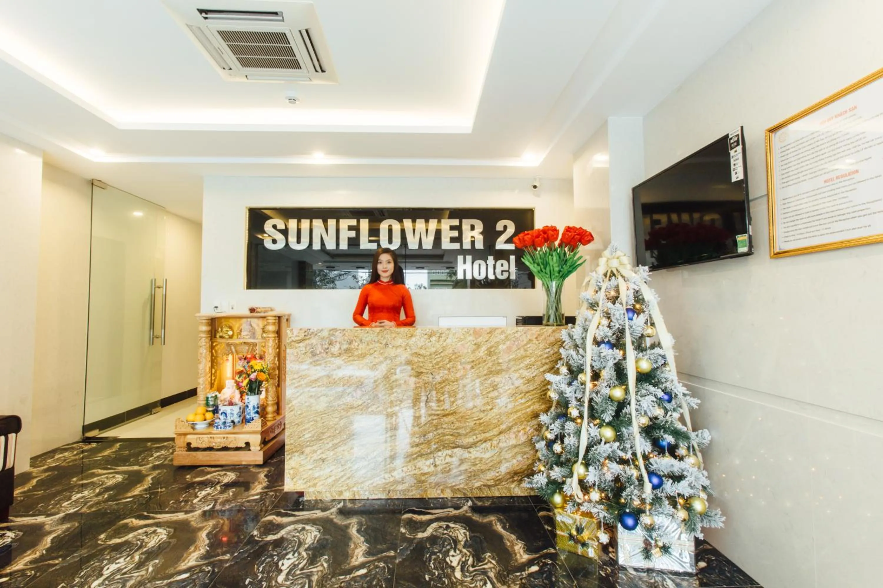 Property logo or sign in Sunflower Hotel 2