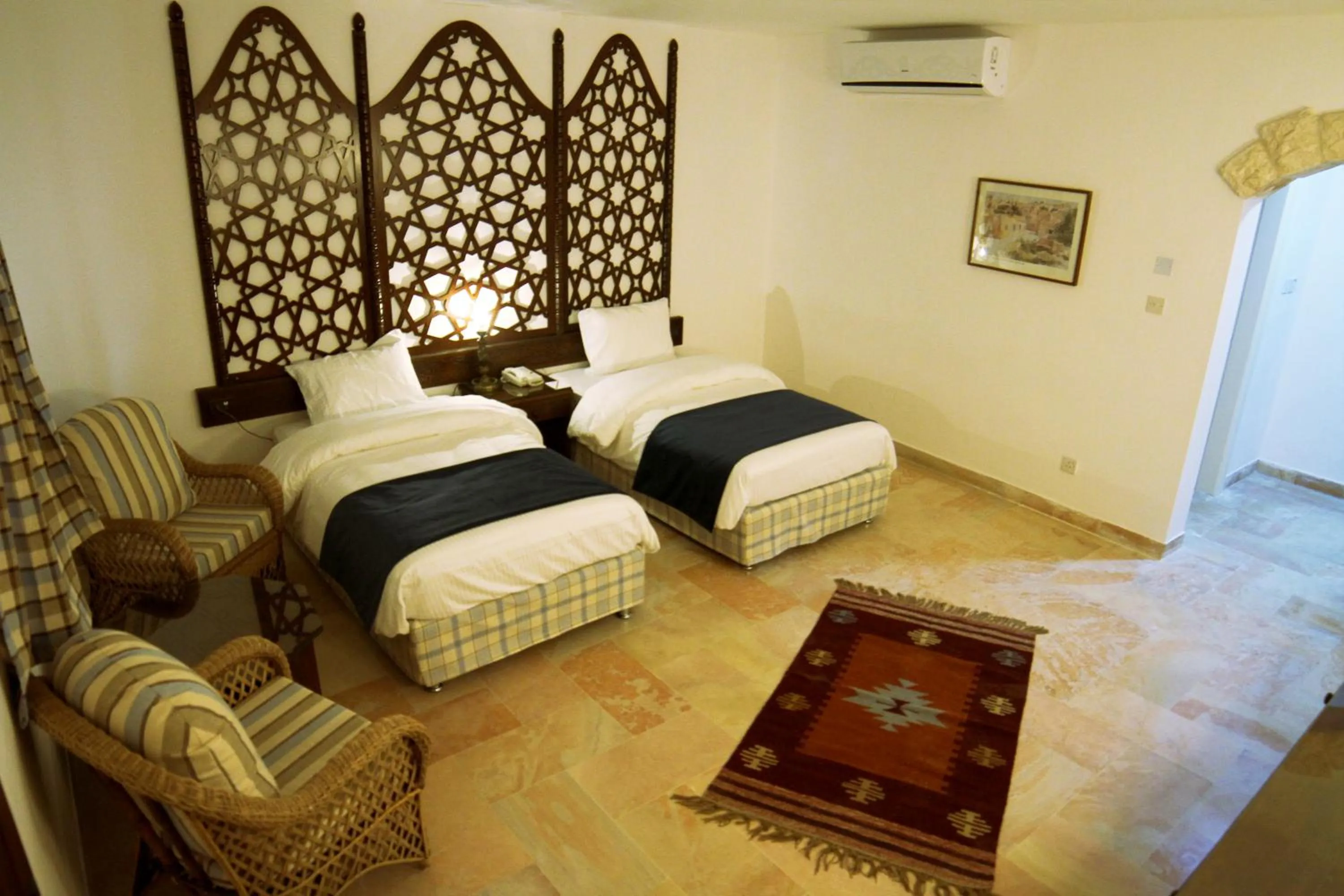 Bed in The Old Village Hotel & Resort