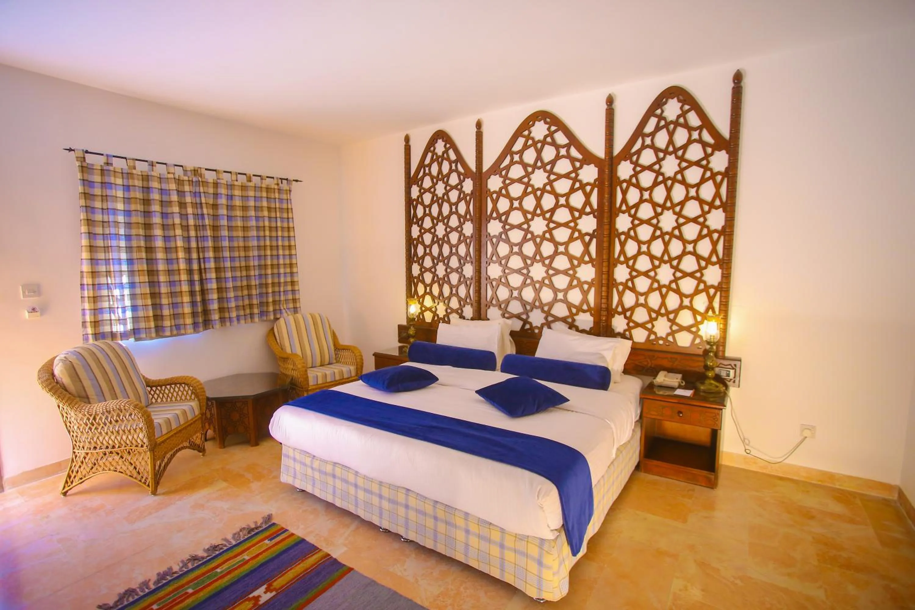 Bed in The Old Village Hotel & Resort