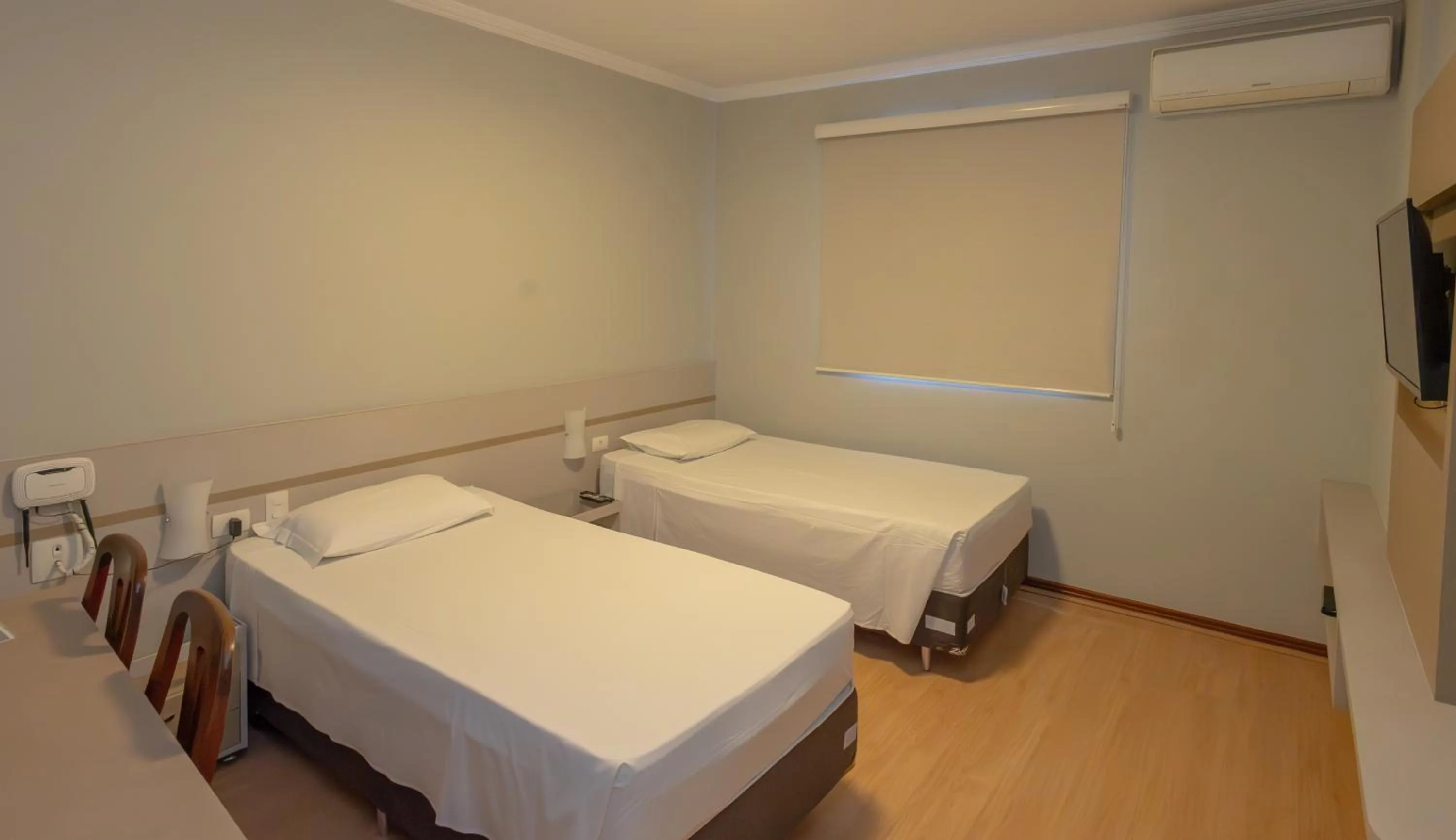 Bed in Lizon Curitiba Hotel